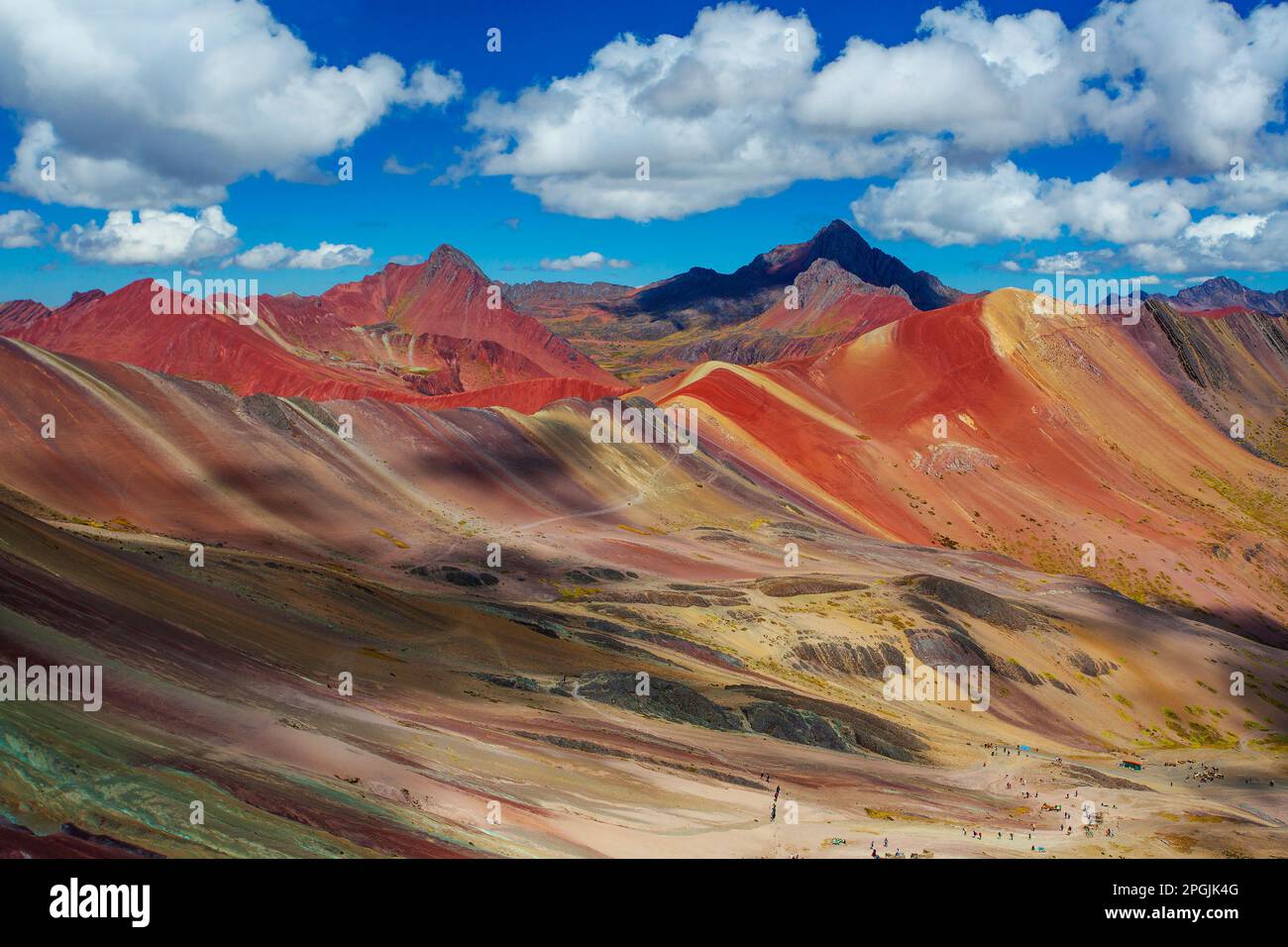Hiking scene in Vinicunca, Cusco Region, Peru. Rainbow Mountain (Montana de Siete Colores). Stock Photo