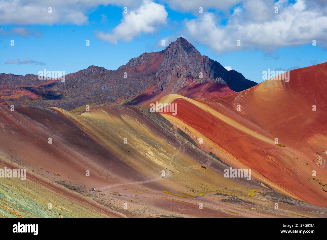 Hiking scene in Vinicunca, Cusco Region, Peru. Rainbow Mountain (Montana de Siete Colores). Stock Photo