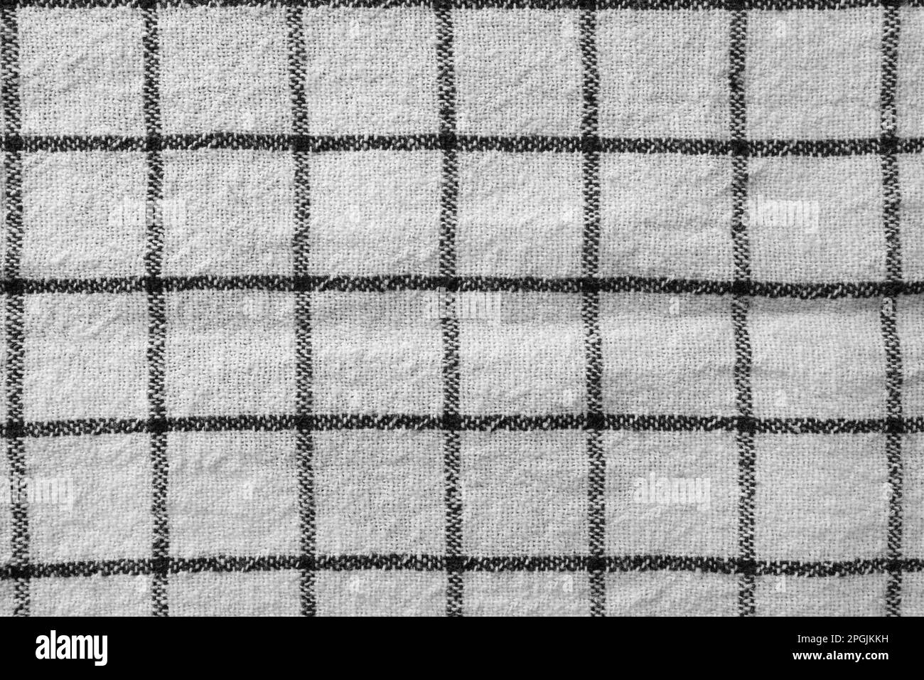 Classic black and white checkered kitchen towel texture. Fabric textile