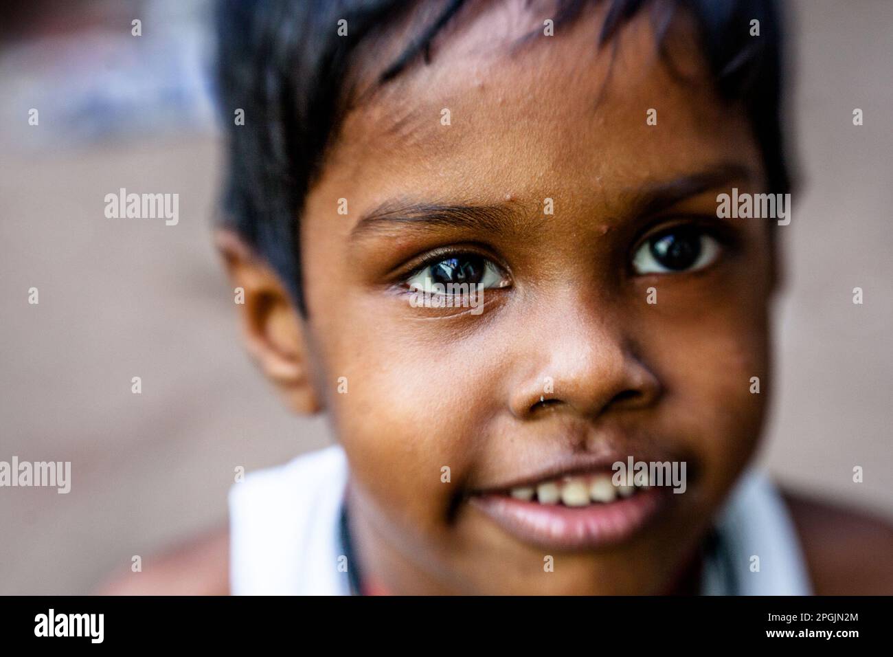 VARANASI, INDIA - OCTOBER 29, 2013: Unidentified beggar child on the street in Varanasi. Poverty is a major issue in India. Stock Photo