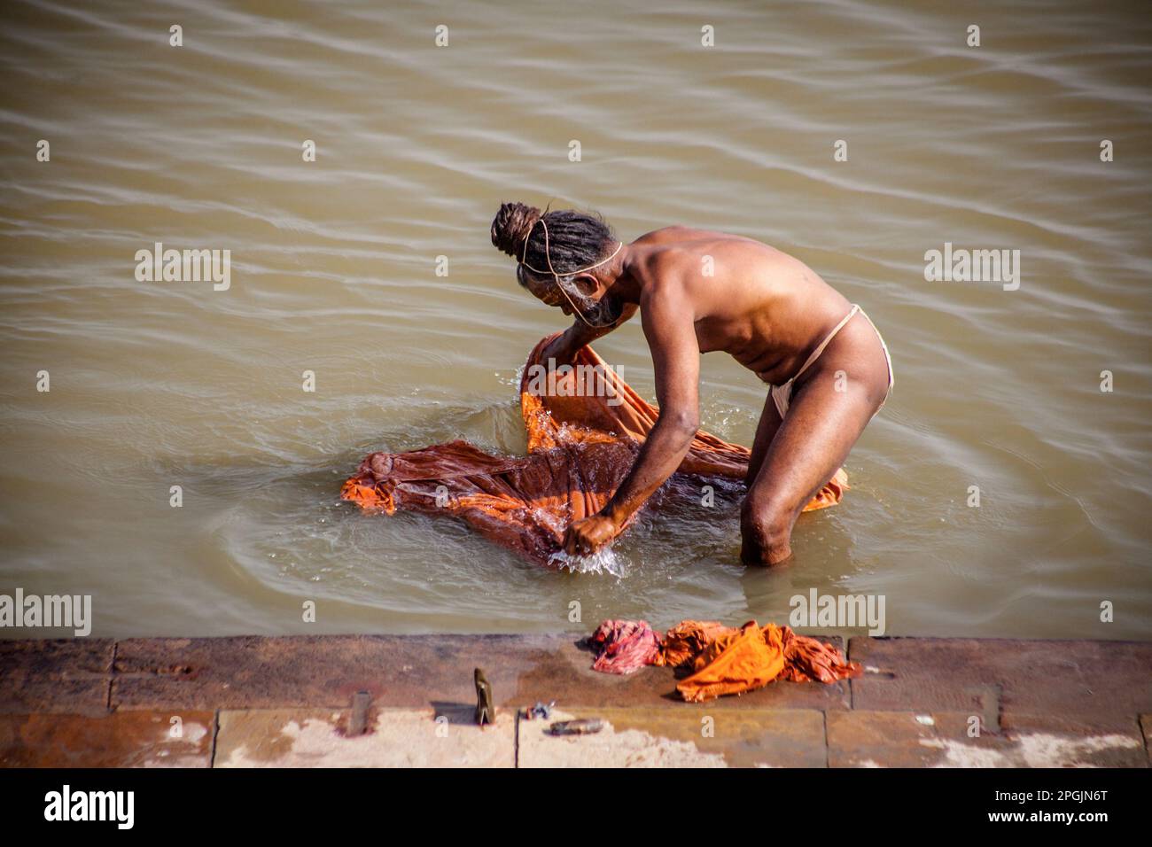 VARANASI, INDIA - OCTOBER 29, 2013: Hindu Aghori take a holy bath in the river ganges  in Varanasi, Uttar Pradesh,  India Stock Photo