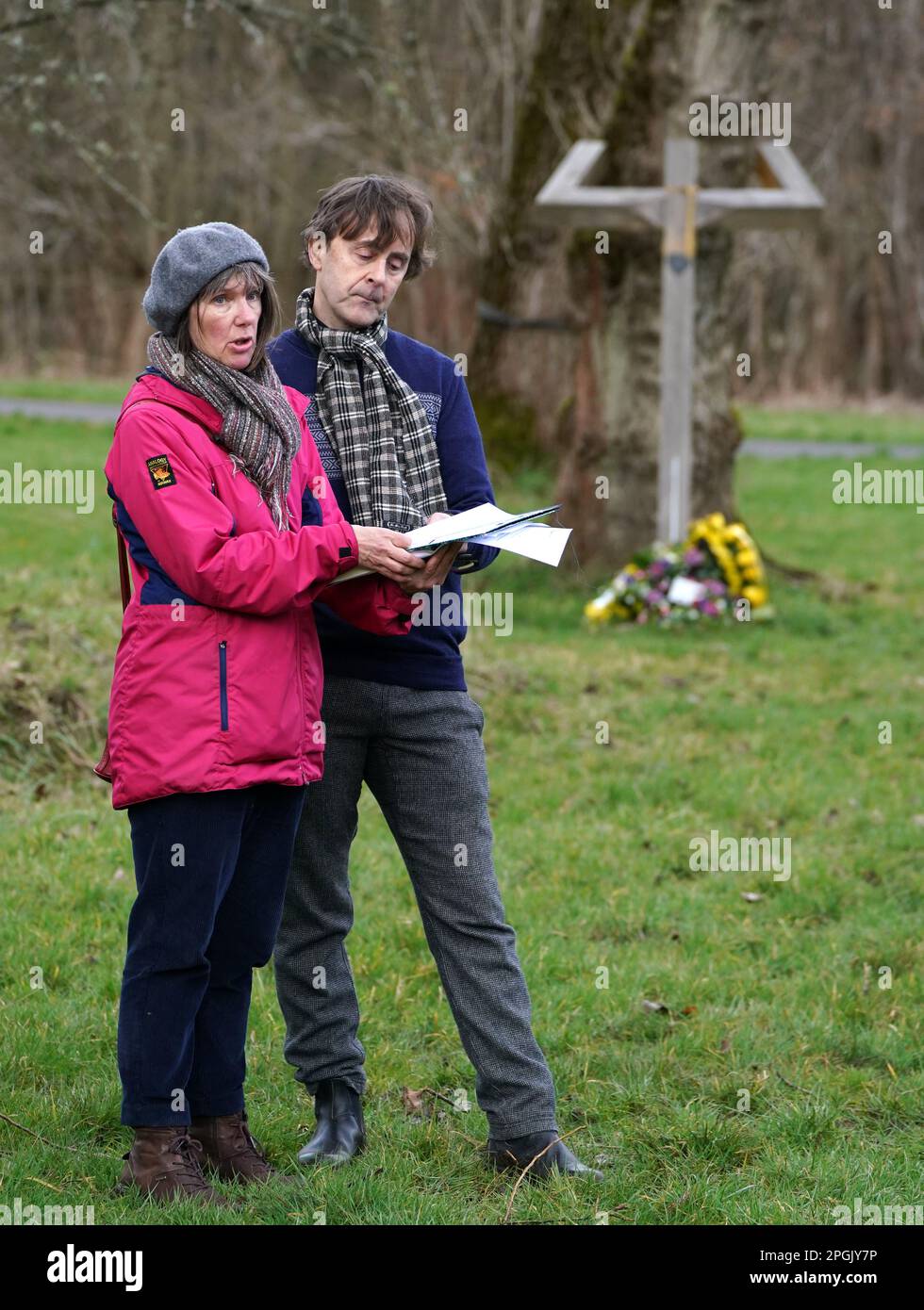 Scotland's Makar Kathleen Jamie alongside Alec Finlay as they read a poem after a minute's silence at Scotland's Covid Memorial in Glasgow to mark third anniversary of Covid-19 pandemic as part of the National Day of Reflection. Picture date: Thursday March 23, 2023. Stock Photo