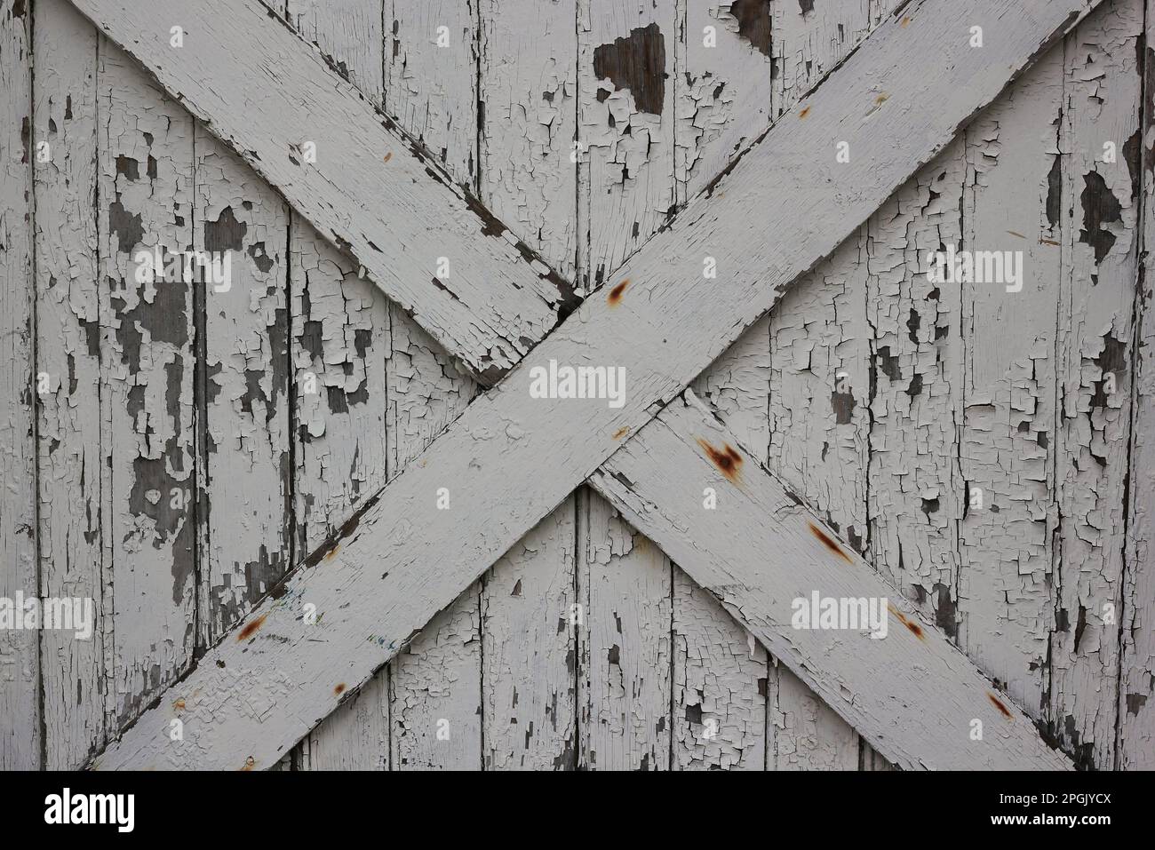 An old worn and weathered wooden wall with cross bracing Stock Photo