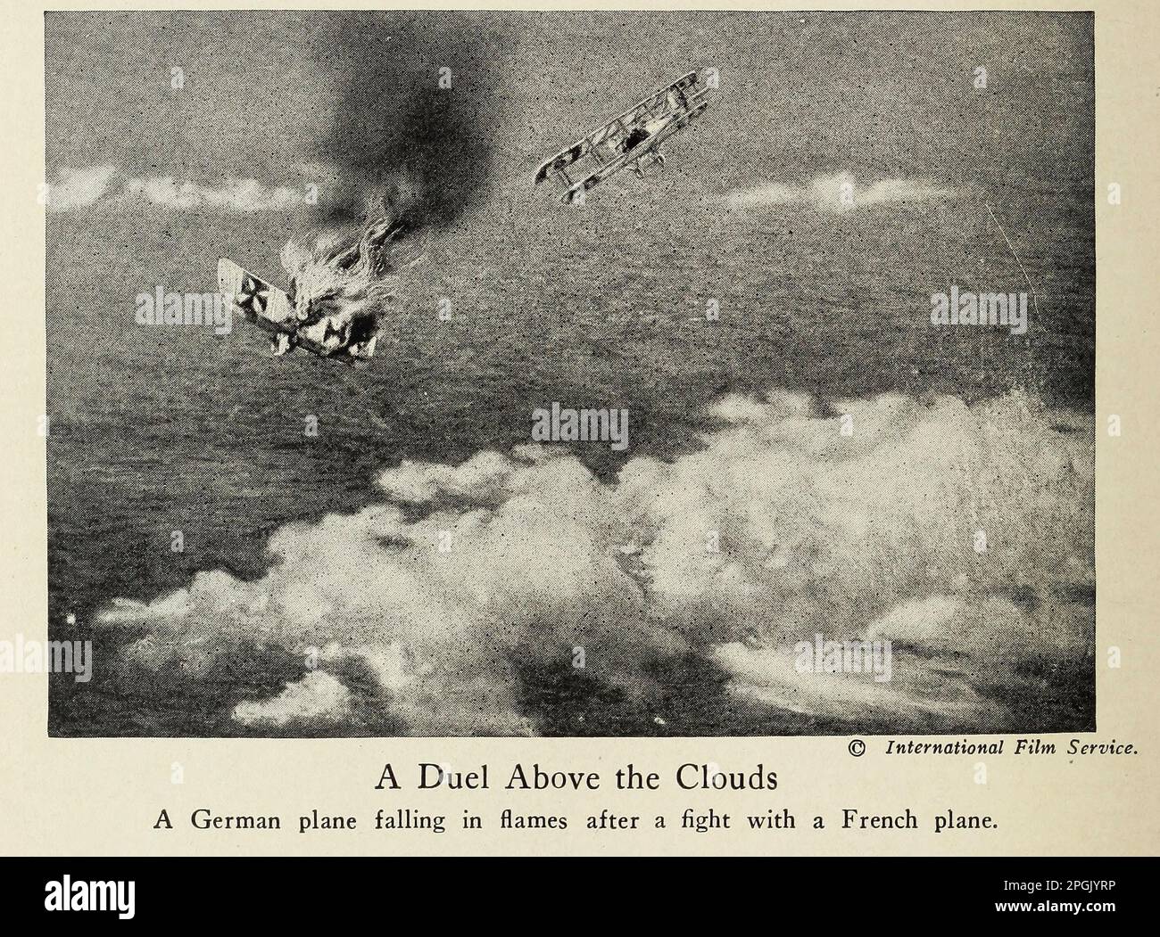 A Duel Above the Clouds A German plane falling in flames after a fight with a French plane. from the book ' Deeds of heroism and bravery : the book of heroes and personal daring ' by Elwyn Alfred Barron and Rupert Hughes,  Publication Date 1920 Publisher New York : Harper & Brothers Publishers Stock Photo