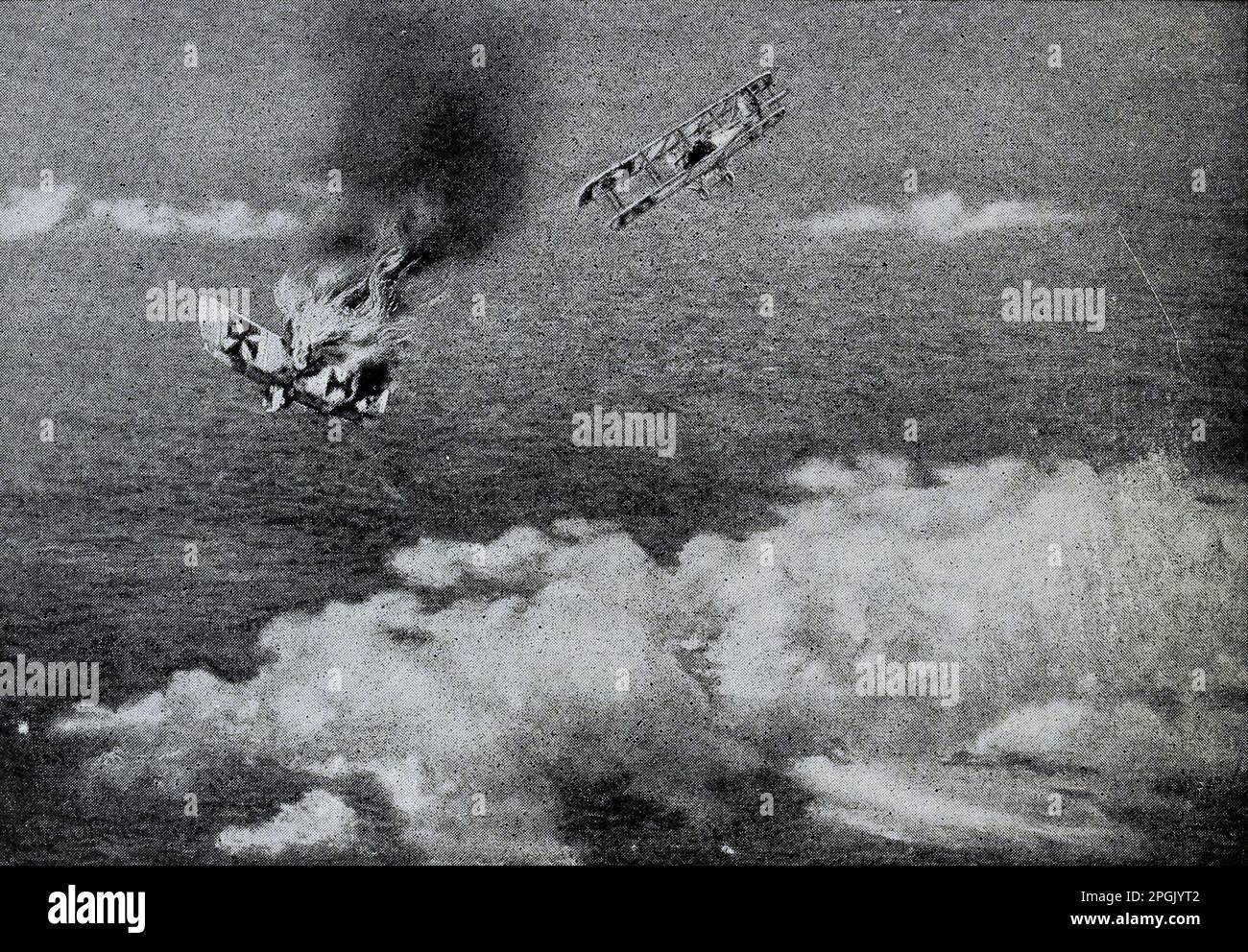 A Duel Above the Clouds A German plane falling in flames after a fight with a French plane. from the book ' Deeds of heroism and bravery : the book of heroes and personal daring ' by Elwyn Alfred Barron and Rupert Hughes,  Publication Date 1920 Publisher New York : Harper & Brothers Publishers Stock Photo