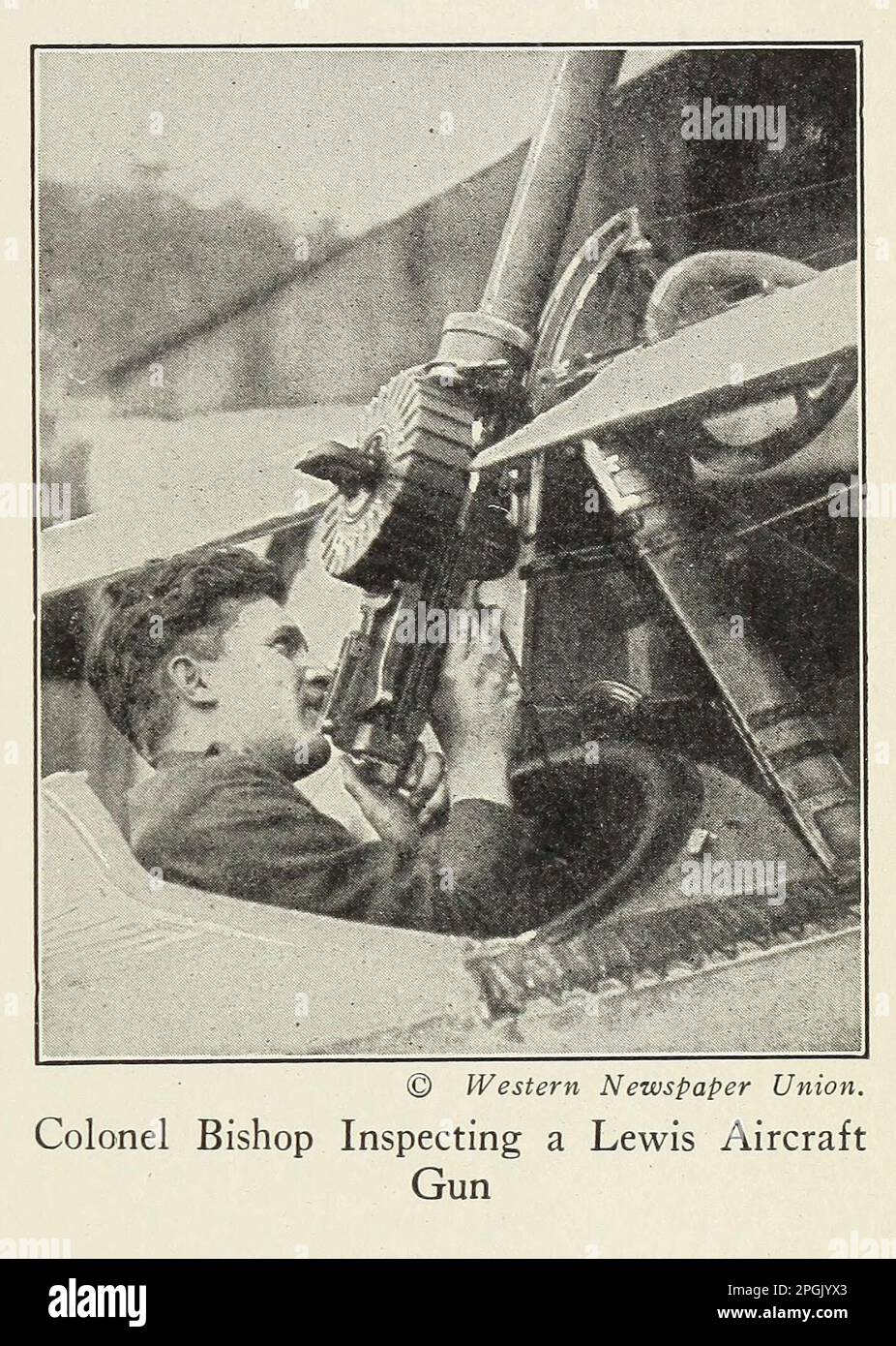 Colonel Bishop Inspecting a Lewis Aircraft Gun from the book ' Deeds of heroism and bravery : the book of heroes and personal daring ' by Elwyn Alfred Barron and Rupert Hughes,  Publication Date 1920 Publisher New York : Harper & Brothers Publishers Stock Photo
