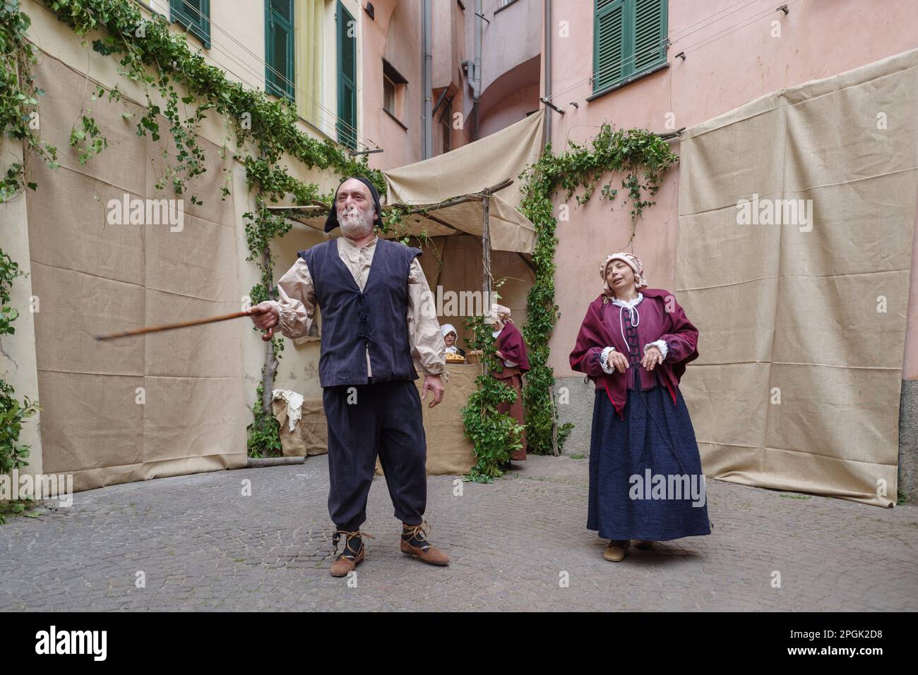 Participants of historical reenactment in the old town of Taggia, in Liguria region of Italy Stock Photo