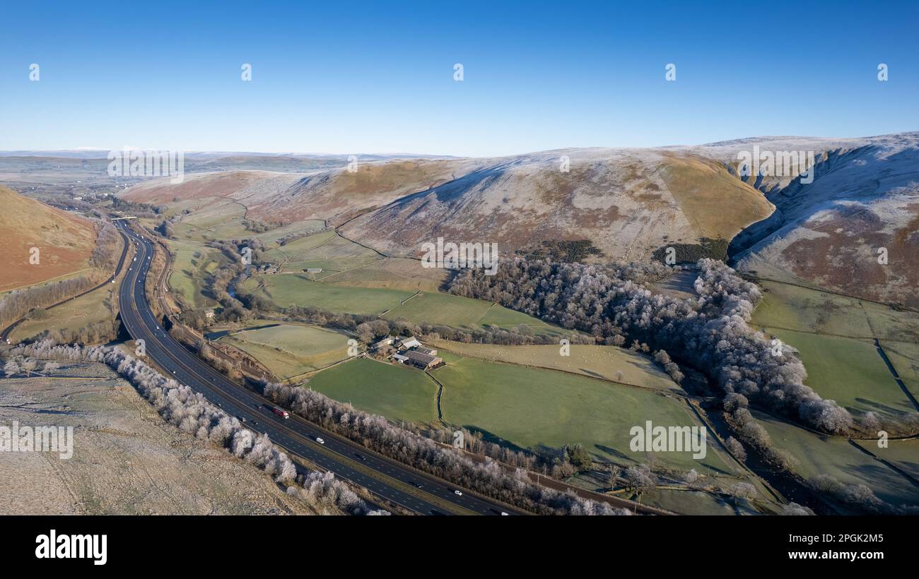 The Lune Gap, on a frosty morning, in the Howgill Fells near Tebay where the M6 motorway passes through and also the West Coast Mainline from London t Stock Photo