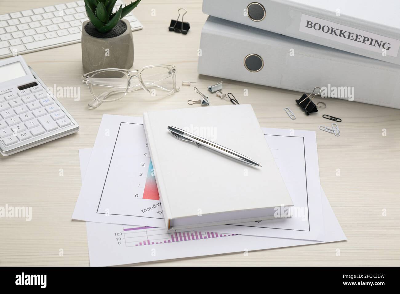 Bookkeeper's workplace with folders and documents on table Stock Photo