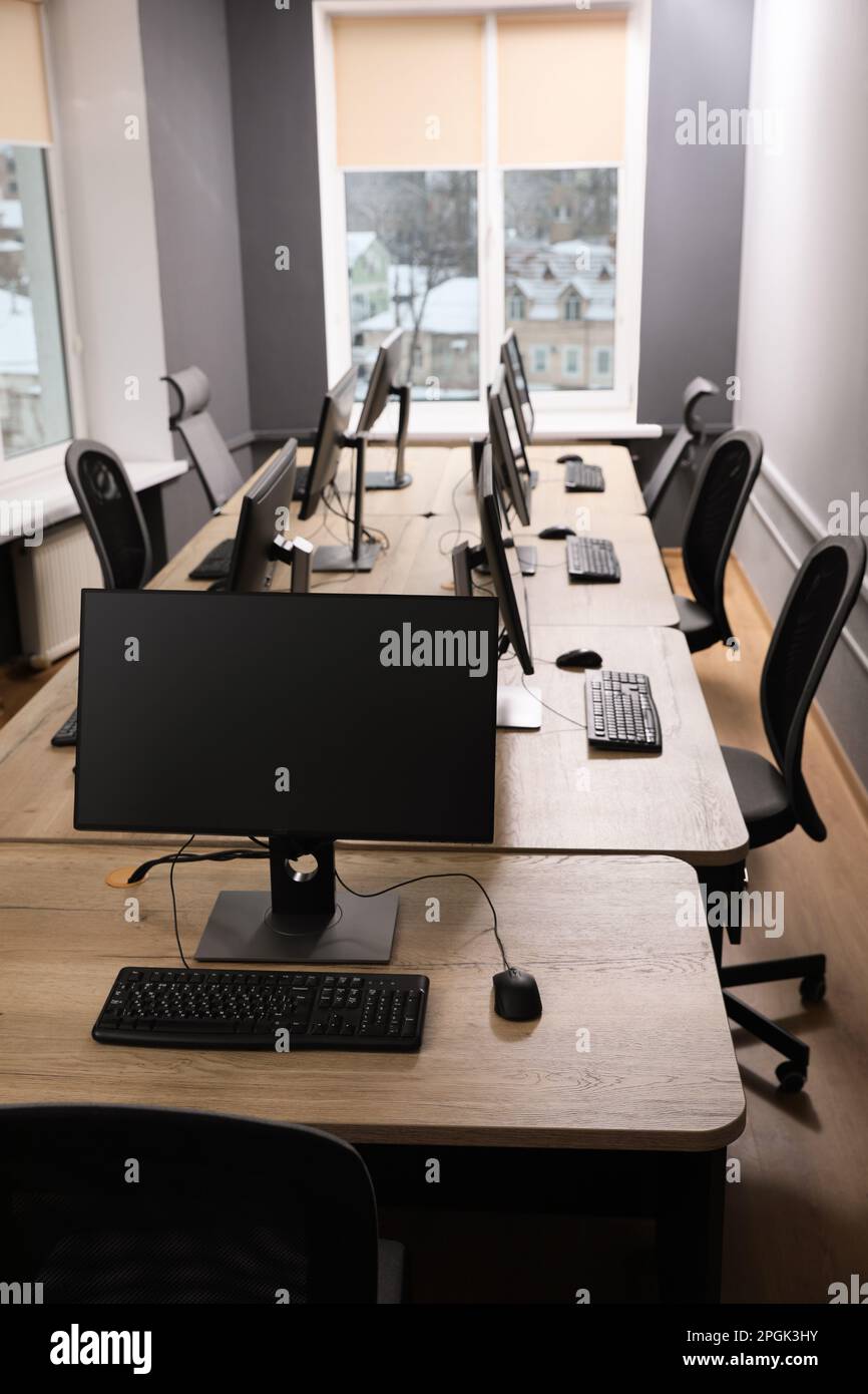 Many modern computers in open space office Stock Photo - Alamy