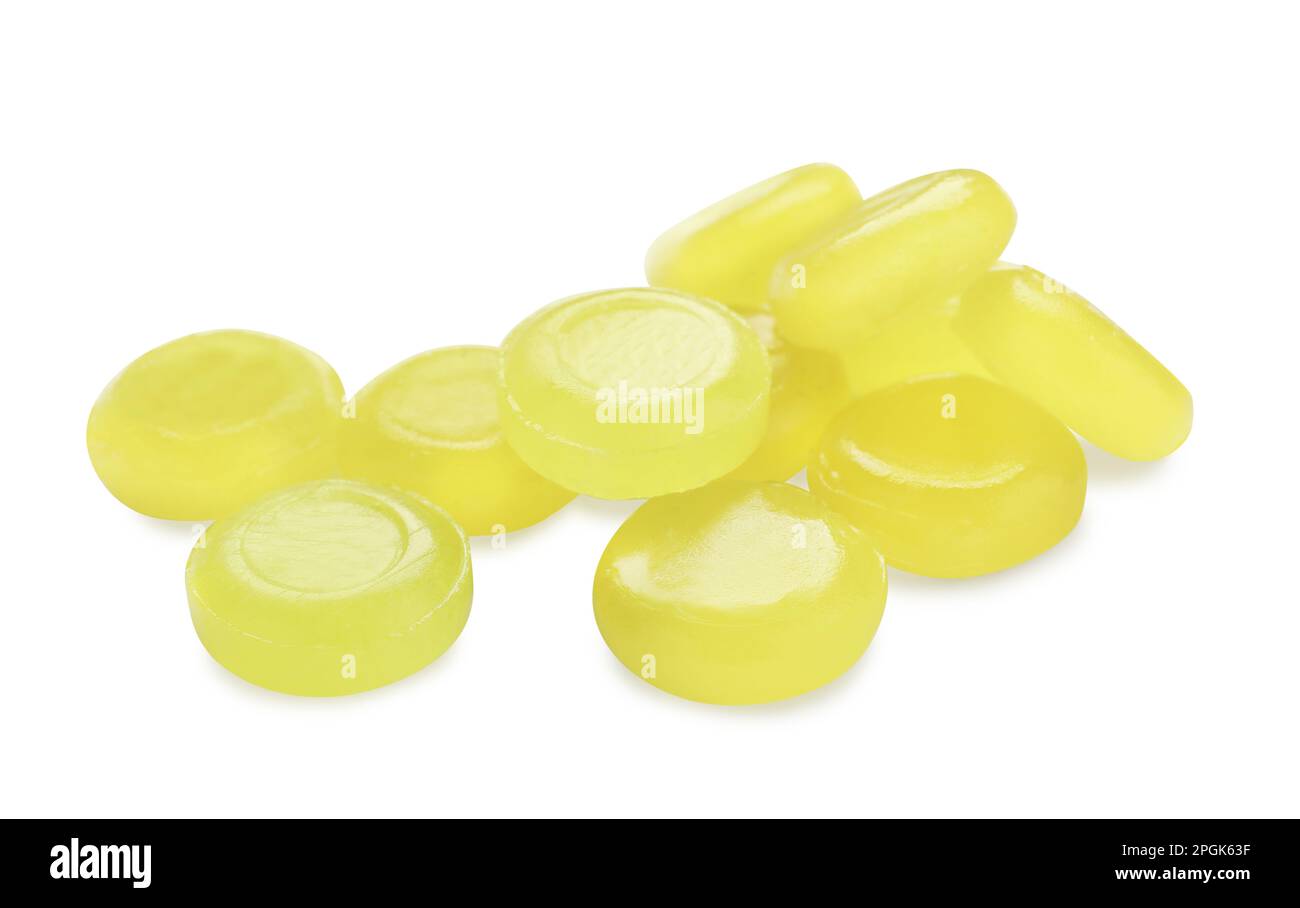 Many yellow cough drops on white background Stock Photo Alamy