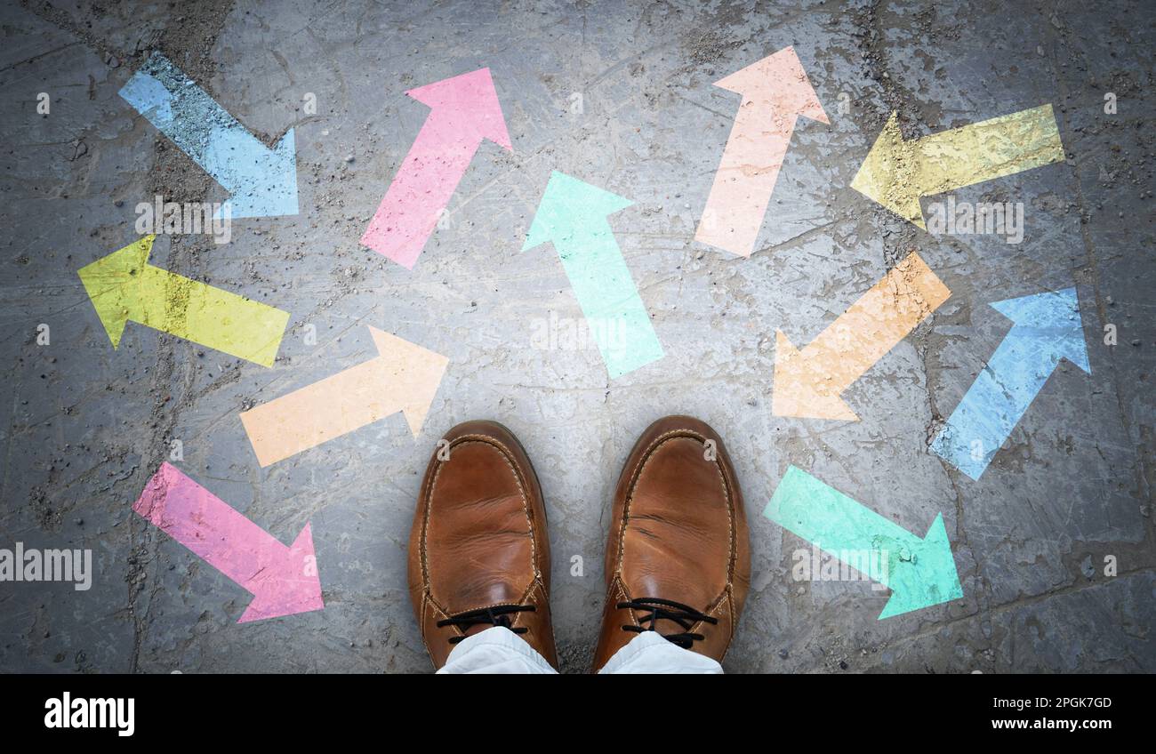 Brown leather shoes and many colorful chalky arrows in various ...