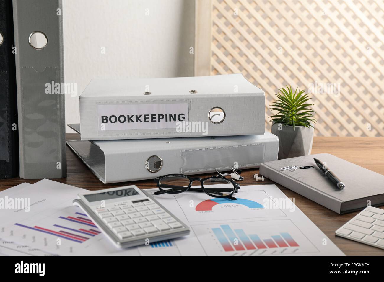 Bookkeeper's workplace with folders and documents on table Stock Photo