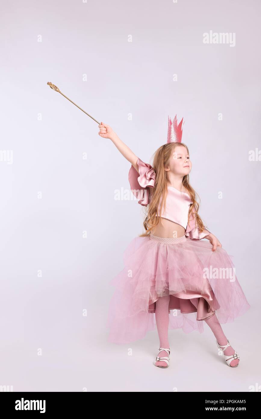 sachin and babi light blue dress Cute Girl in Fairy Dress with Small Crown on Light Grey Background, Space  for Text. Little Princess Stock Photo