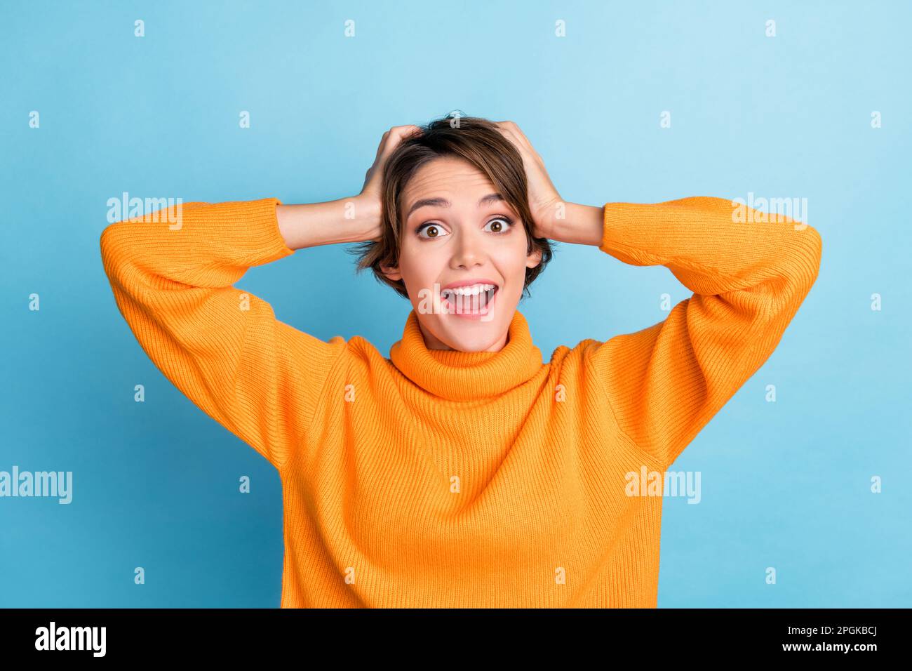 Portrait of astonished positive lady hands touch head open mouth ...