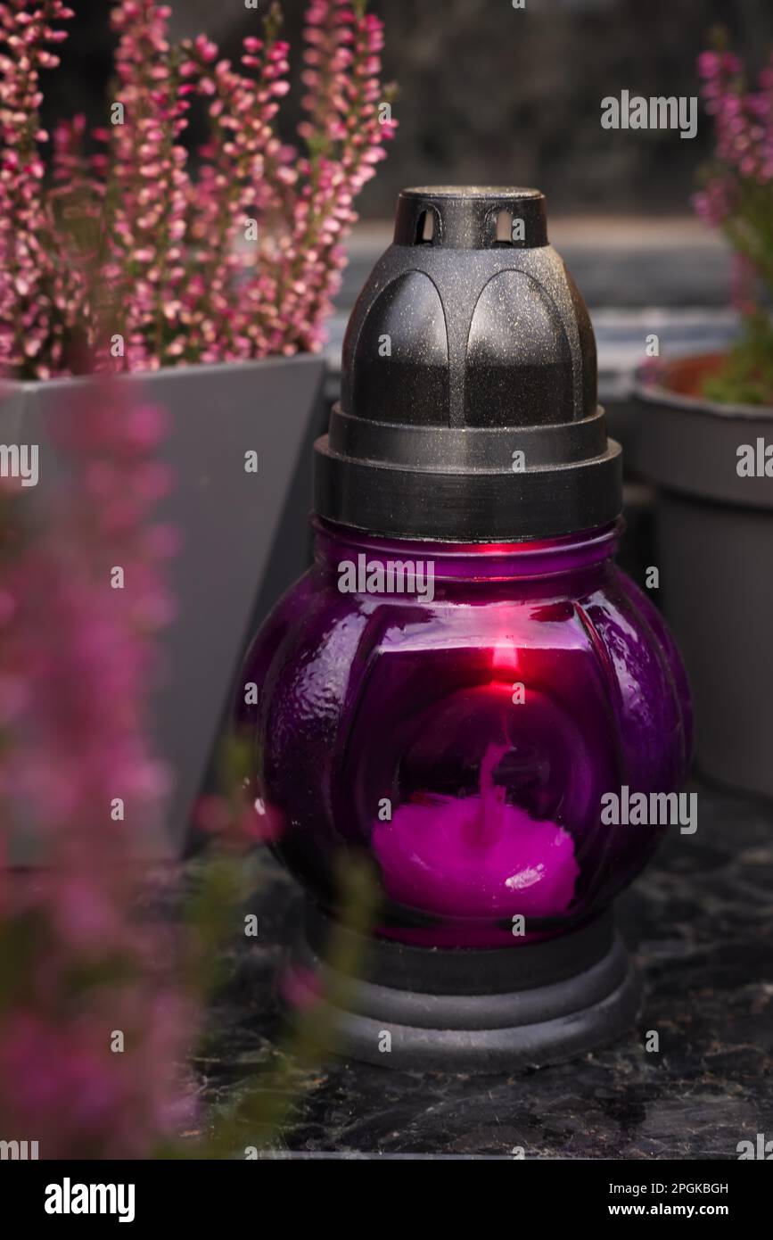 Grave lantern on grey granite surface at cemetery Stock Photo - Alamy