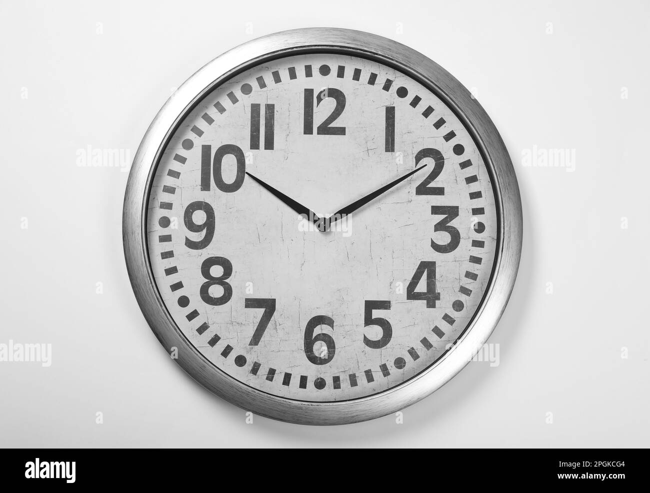 Stylish analog clock hanging on white wall Stock Photo Alamy