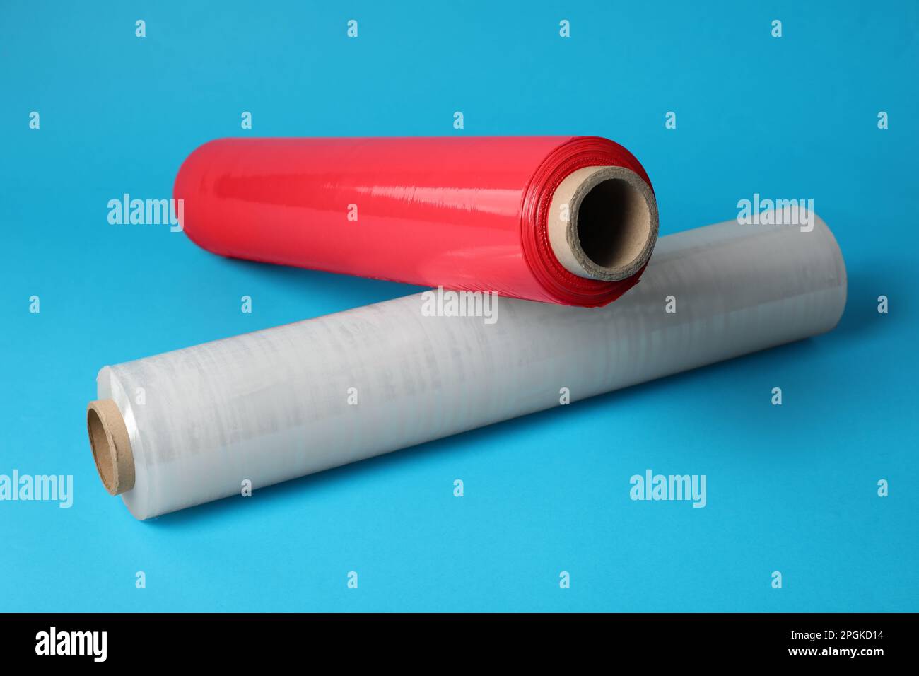 Rolls of different plastic stretch wrap on light blue background Stock Photo Alamy