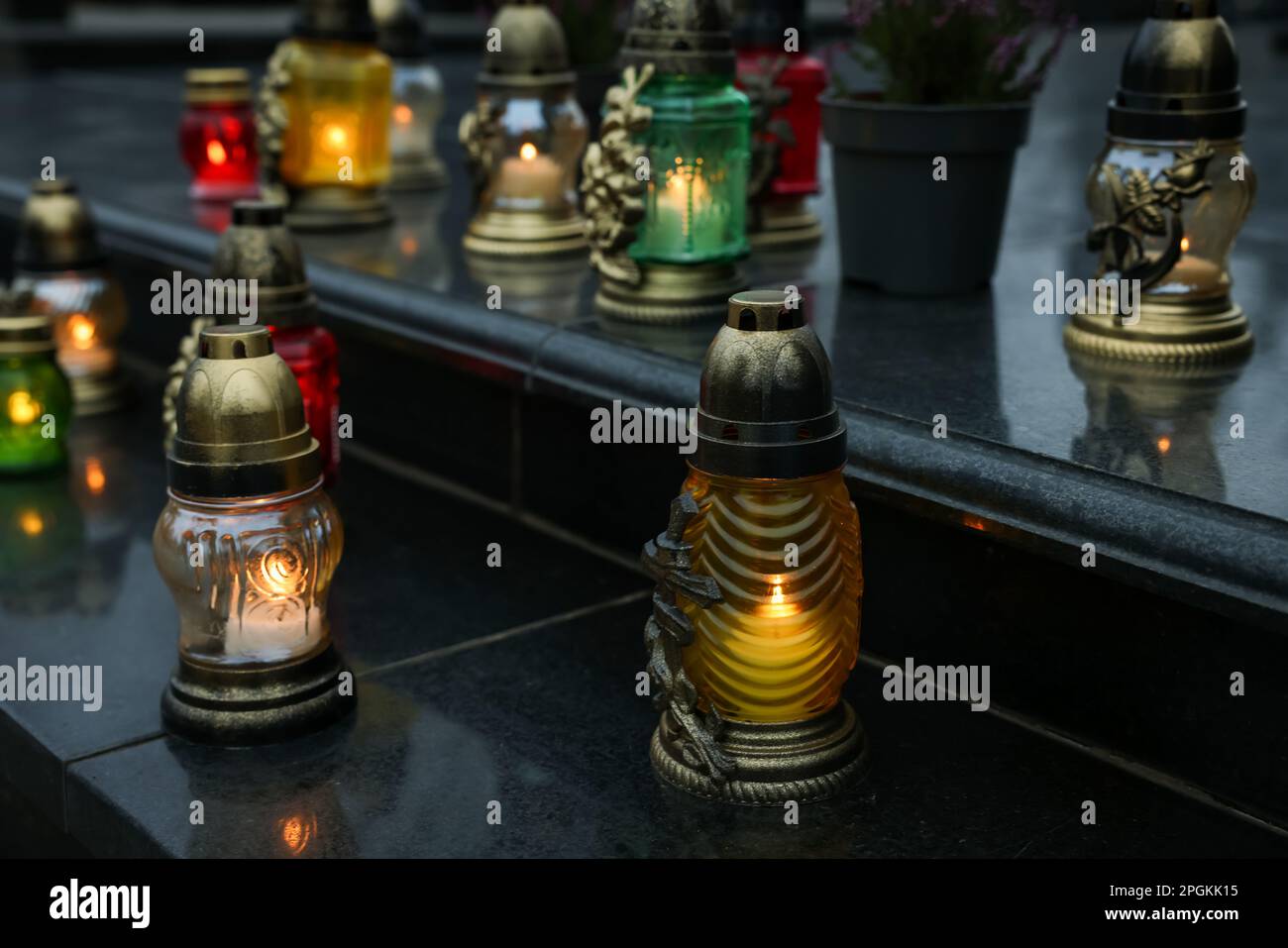 Grave lights on granite surface at cemetery Stock Photo Alamy