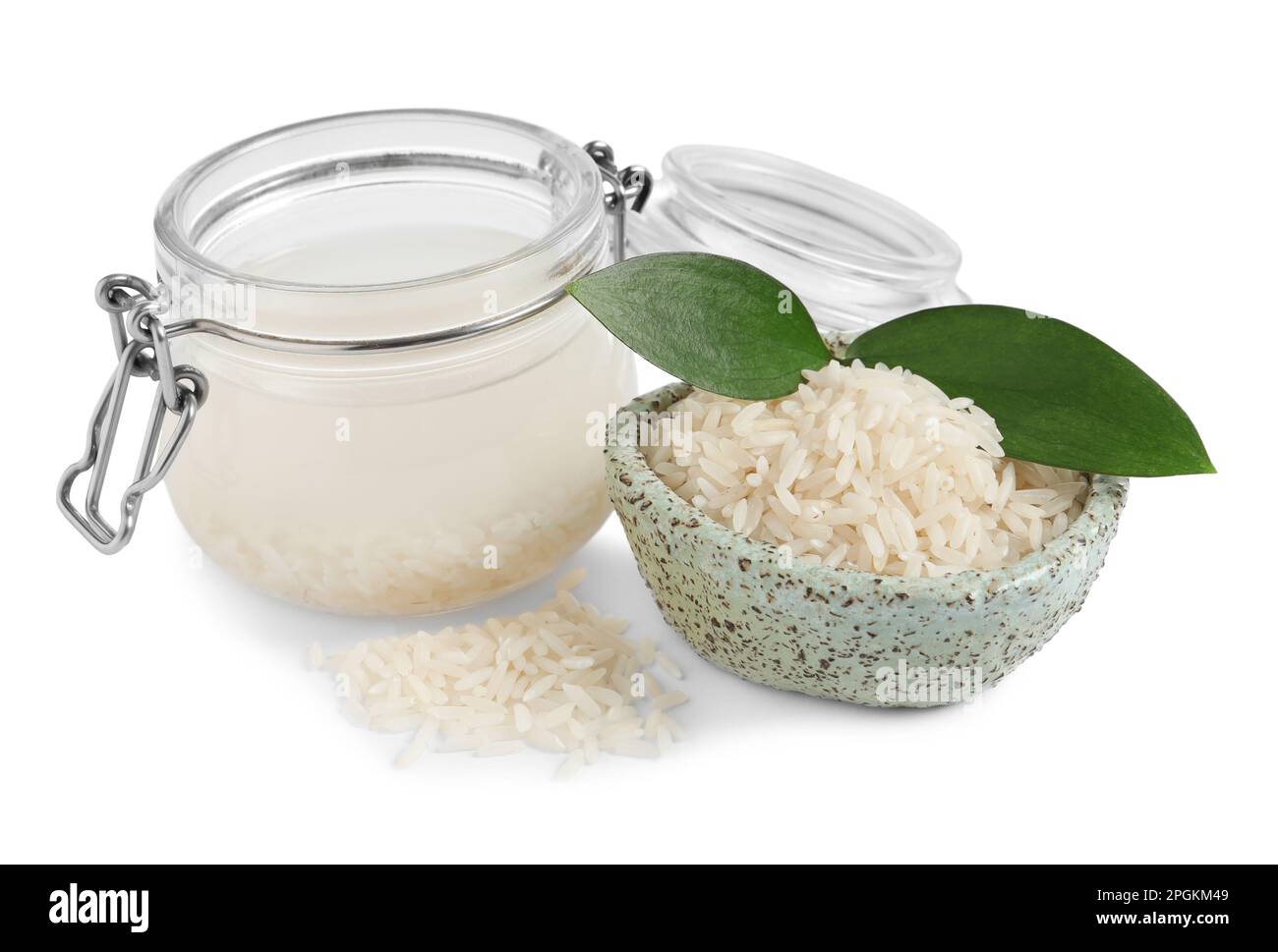 Homemade natural rice water and grains on white background Stock Photo ...