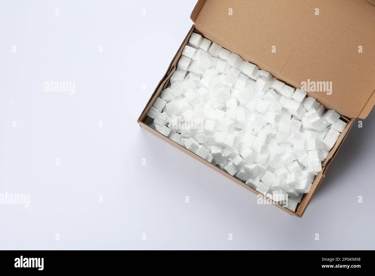 Cardboard box with styrofoam cubes isolated on white, top view Stock