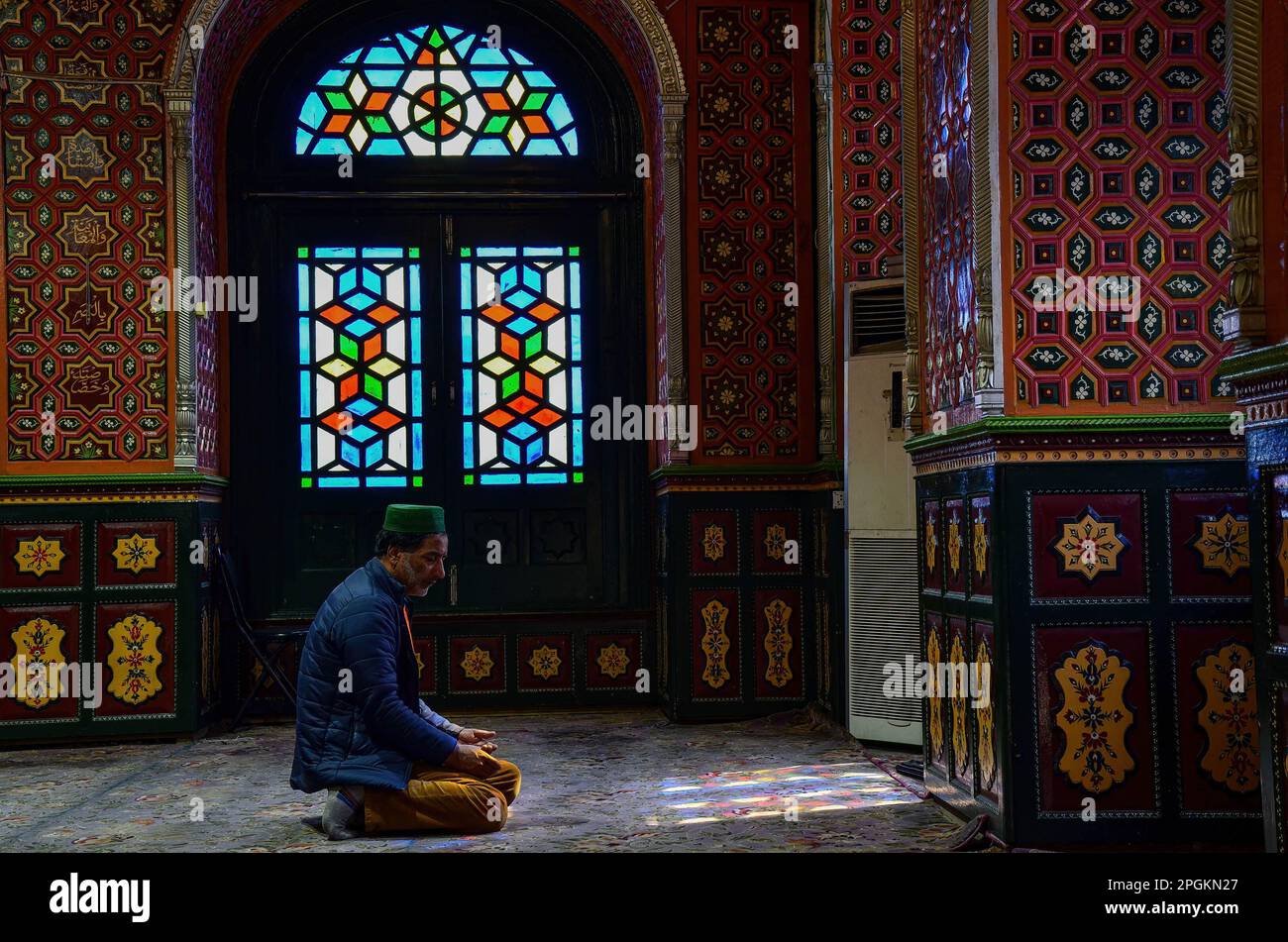 Srinagar, India. 23rd Mar, 2023. A Kashmiri Muslim devotee prays inside ...