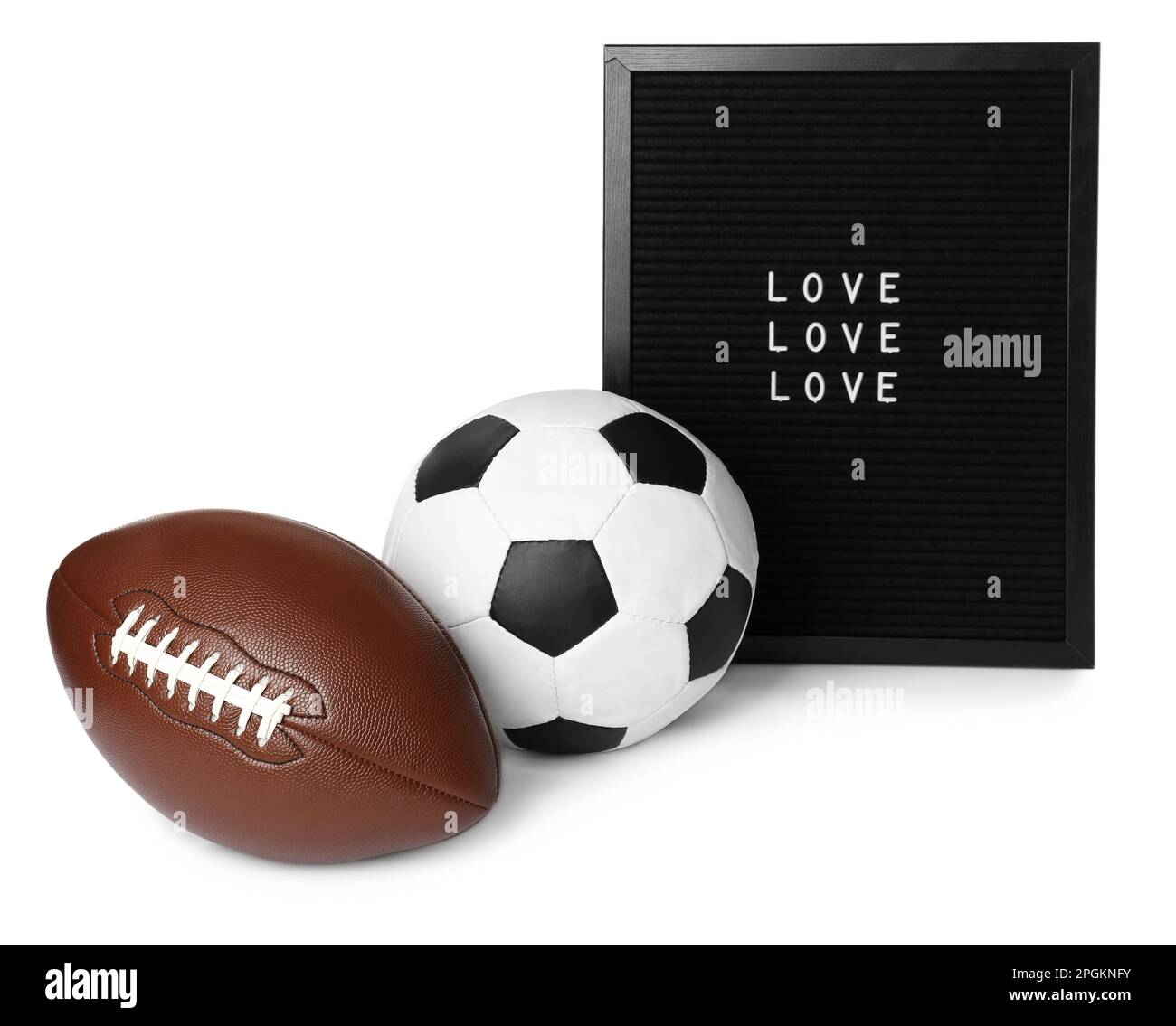 American football and soccer ball near letter board with words Love on