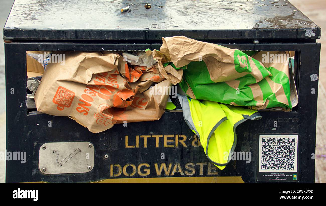 Glasgow, Scotland, UK 23rd  March, 2023. UK Weather: Wet in the city centre afternoon saw the locals take to the streets. The city litter problem sees bins overflowing. Credit Gerard Ferry/Alamy Live News Stock Photo