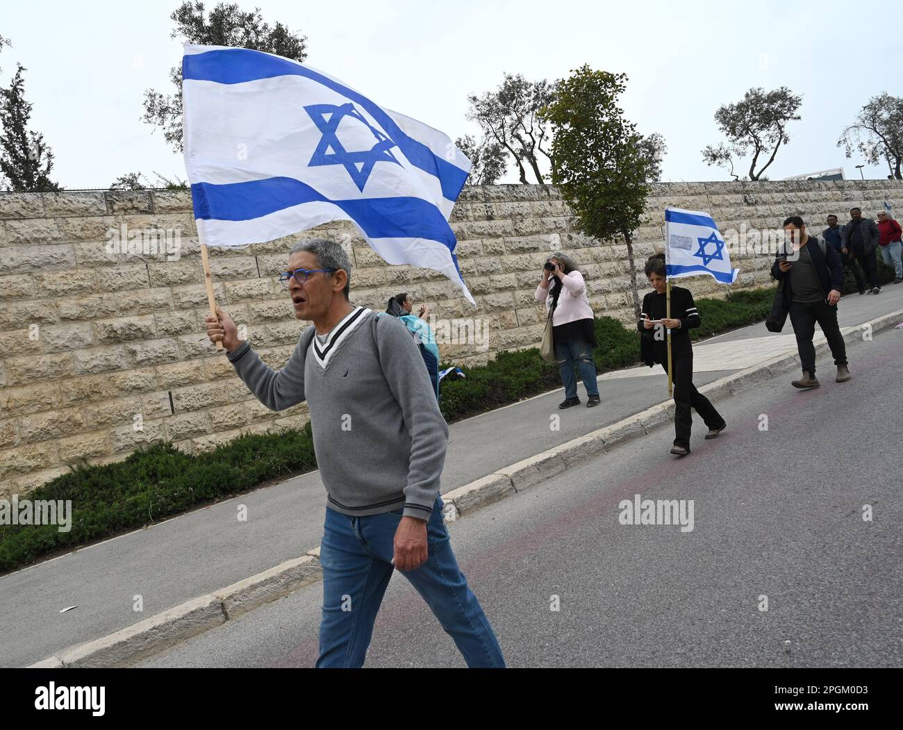 Jerusalem, Israel. 23rd Mar, 2023. Israelis carry the national flag ...
