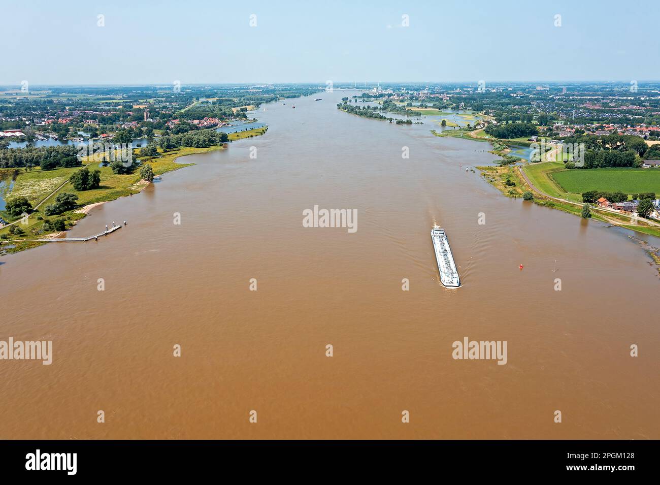 Aerial from a freighter cruising on the river Merwede near Woudrichem and Gorinchem in the Netherlands Stock Photo