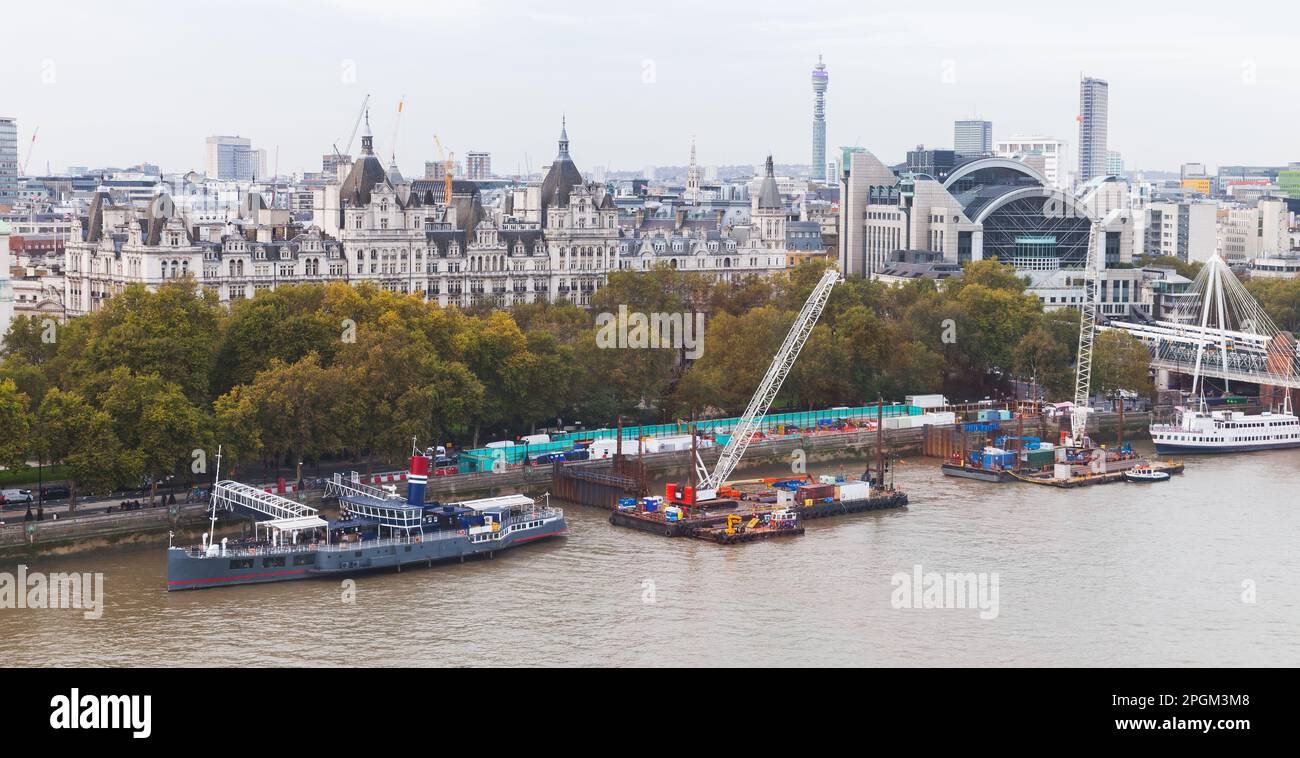 London cityscape aerial view. Thames river coast with floating pub and Waterloo station is on a background Stock Photo