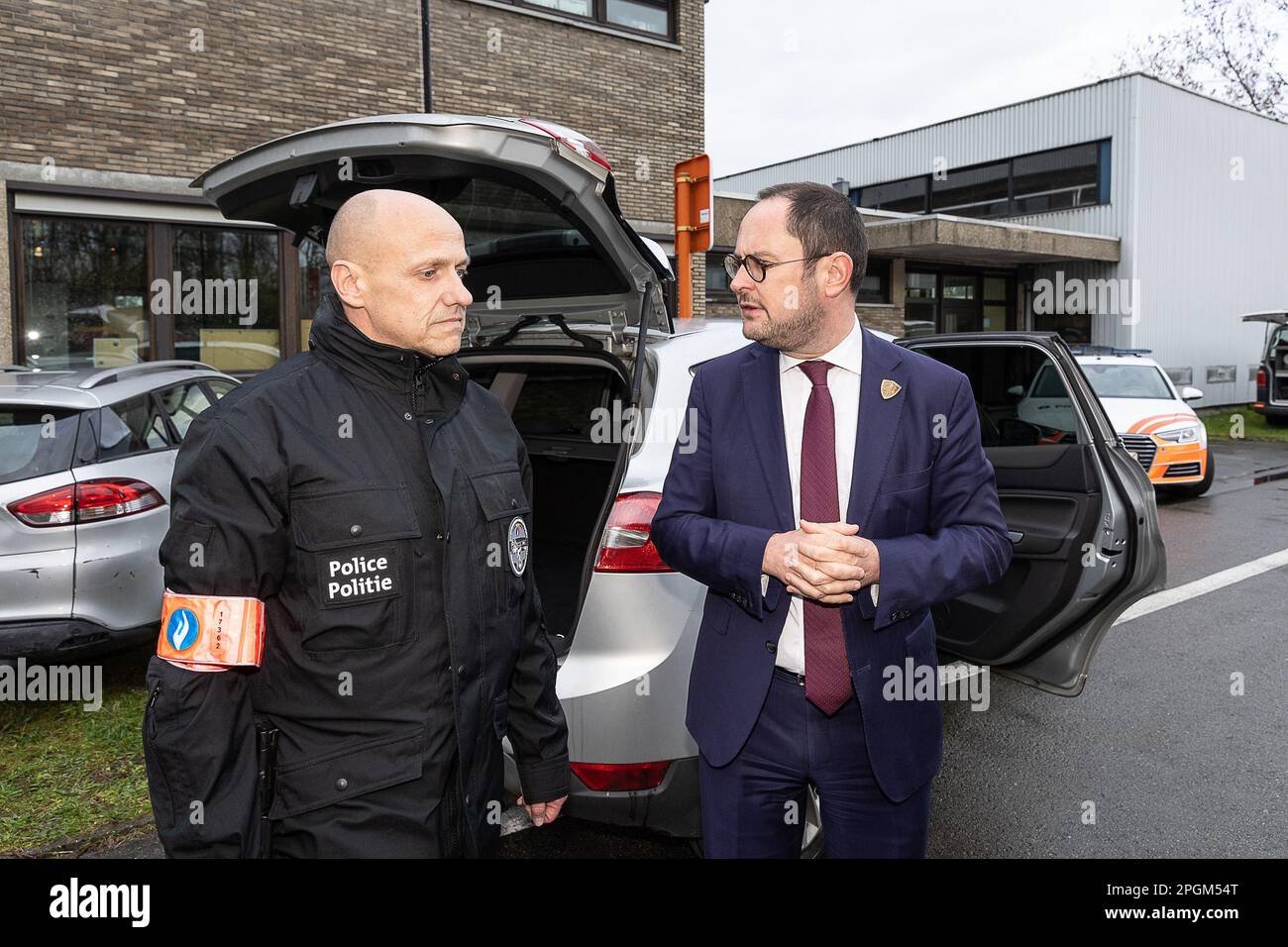 Police officer Bart Vertessen and Justice Minister Vincent Van Quickenborne pictured during a press moment of the cabinet of the minister of Justice and the federal police on the criminalization of hidden spaces in vehicles, in Gentbrugge, Ghent, Thursday 23 March 2023. In 2022, the Drugs section of the Central Directorate of the fight against serious and organized crime in Belgium discovered 95 hidden spaces in vehicles. This resulted in the seizure of, among other things, 1.7 million euros in cash, 1.8 tons of cocaine, weapons, mobile phones and other drugs, a record. In about 2 out of 3 obs Stock Photo