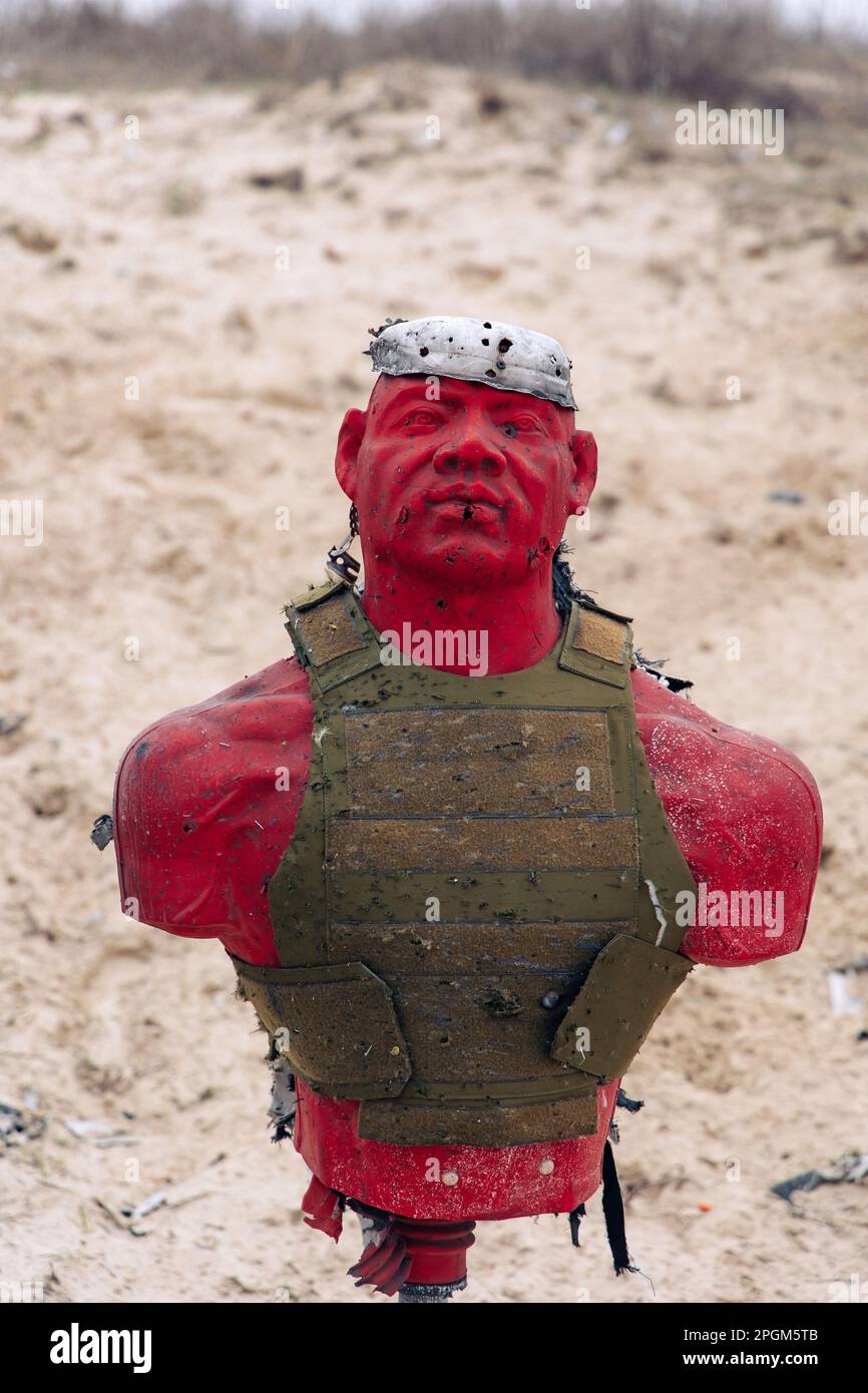 Dummy in body armor shot through with firearm at training shooting