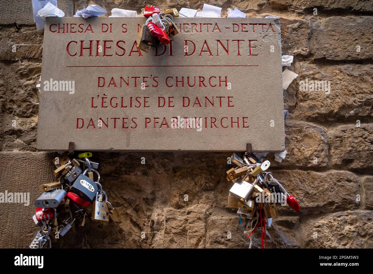 Love locks tied to the sign for Dante's church. Dante Alighieri, author of the Divine Comedy, a Florentine that was sent into exile. Stock Photo