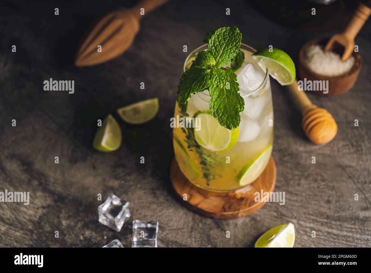 Iced Mojito cocktail long rum drink with fresh mint, fresh thyme, lime