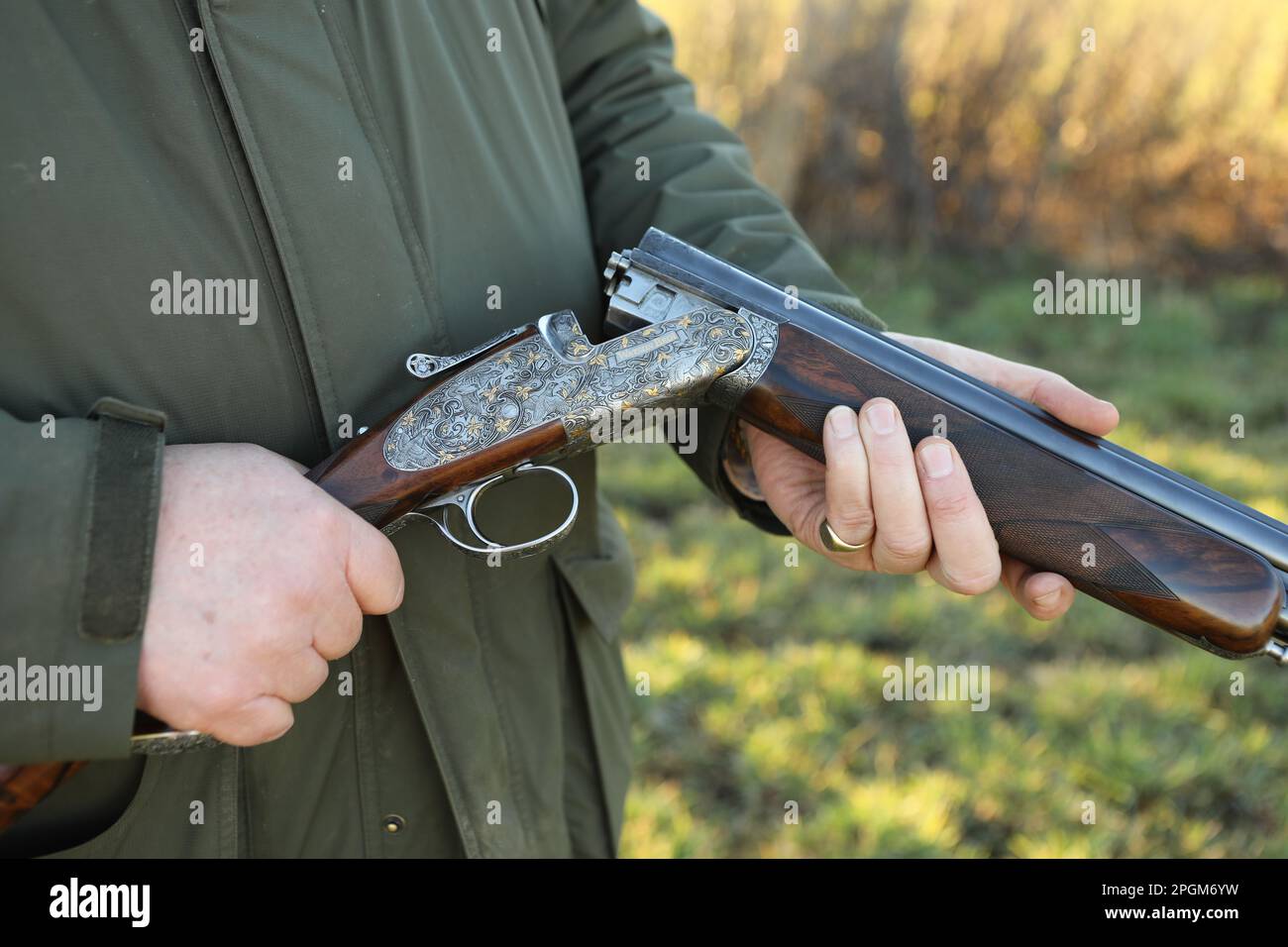 A close up of a man shooting game in the countryside Stock Photo