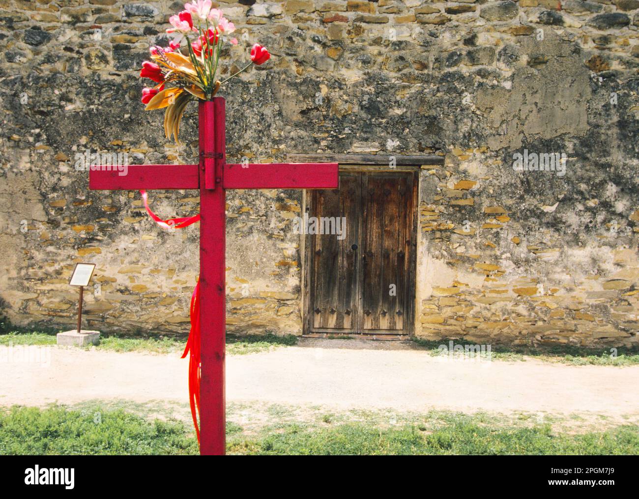 San Juan Capistrano Mission in San Antonio Texas now a museum. Red wood, wooden, crucifix. Spanish Catholic church. National Historical Park. USA Stock Photo
