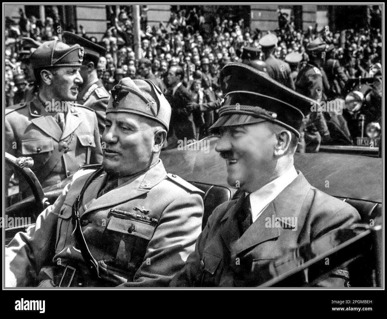 Fuhrer Adolf Hitler and Benito Mussolini el Duce in Munich Nazi Germany in an open top Mercedes Motor car.  Hitler and Mussolini in Munich, Germany, ca.  June 1940.  Eva Braun Album Collection. Axis Leaders WW2 World War II Second World War Stock Photo