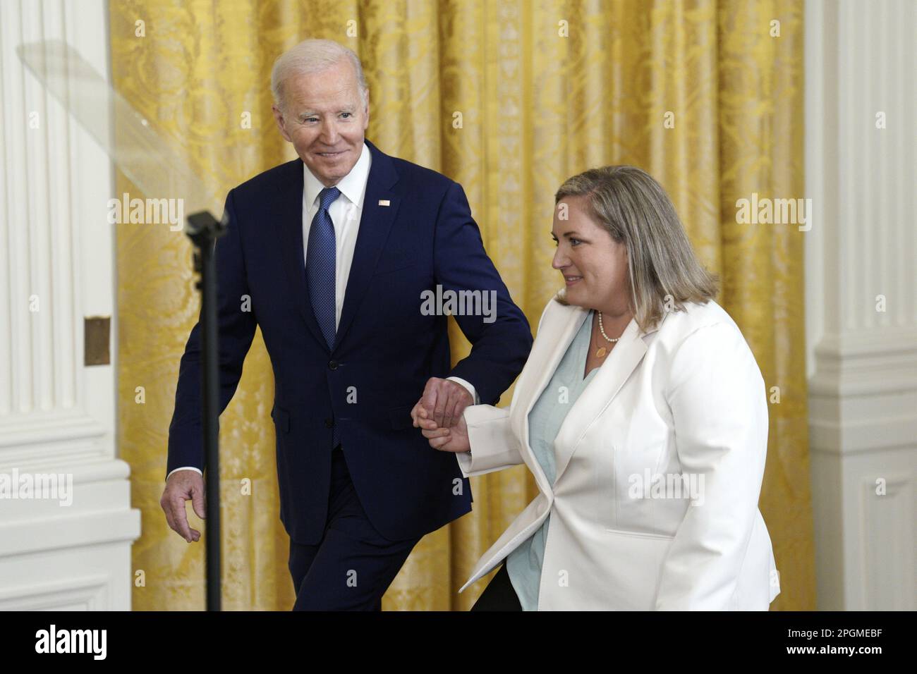 Washington, United States. 23rd Mar, 2023. U.S. President Joe Biden arrives with Teresa Acosta, Introducer and a single mother to a son with Type 1 diabetes who enrolled in ACA coverage in 2020, at an anniversary event for the Affordable Care Act in the East Room at the White House in Washington, DC on Thursday, March 23, 2023. Photo by Yuri Gripas/UPI Credit: UPI/Alamy Live News Stock Photo