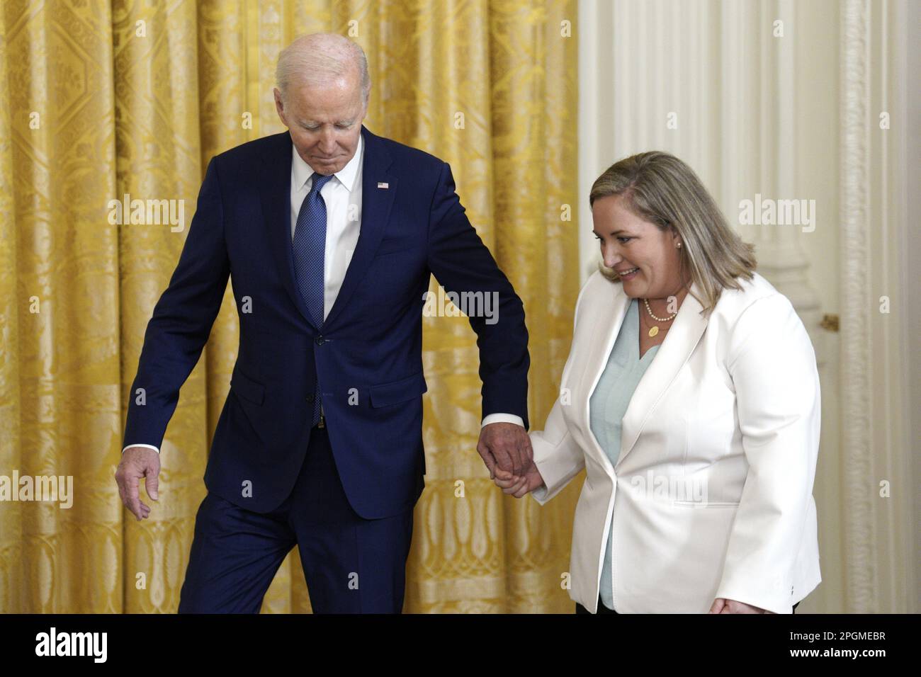 Washington, United States. 23rd Mar, 2023. U.S. President Joe Biden arrives with Teresa Acosta, Introducer and a single mother to a son with Type 1 diabetes who enrolled in ACA coverage in 2020, at an anniversary event for the Affordable Care Act in the East Room at the White House in Washington on March 23, 2023. Photo by Yuri Gripas/UPI Credit: UPI/Alamy Live News Stock Photo
