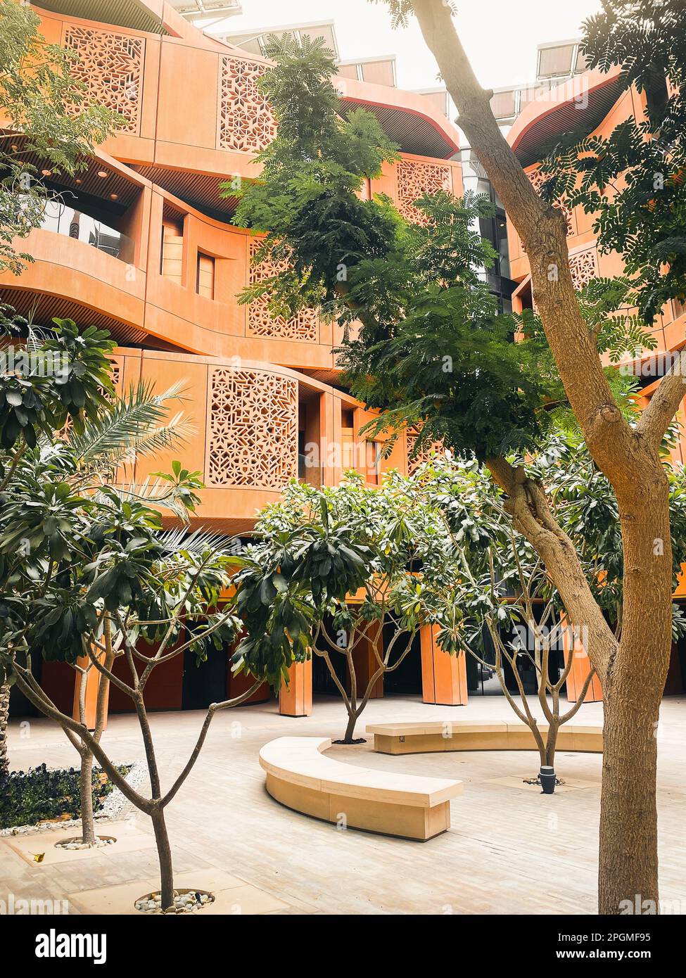 UAE, Abu Dhabi - 13th march, 2023: Eco-friendly architecture and trees in Masdar City, Abu Dhabi Stock Photo