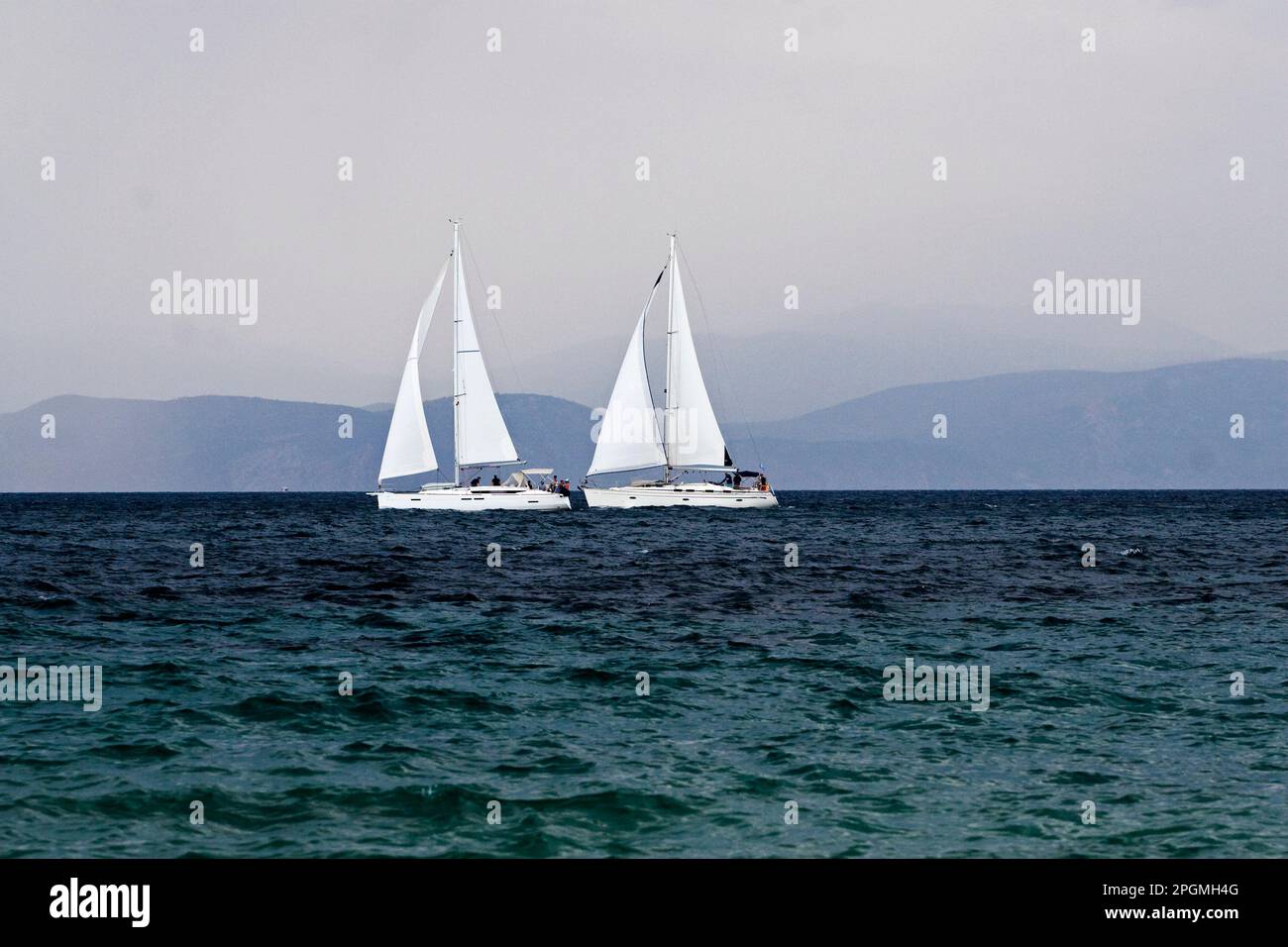 yachts on the horizon Stock Photo - Alamy