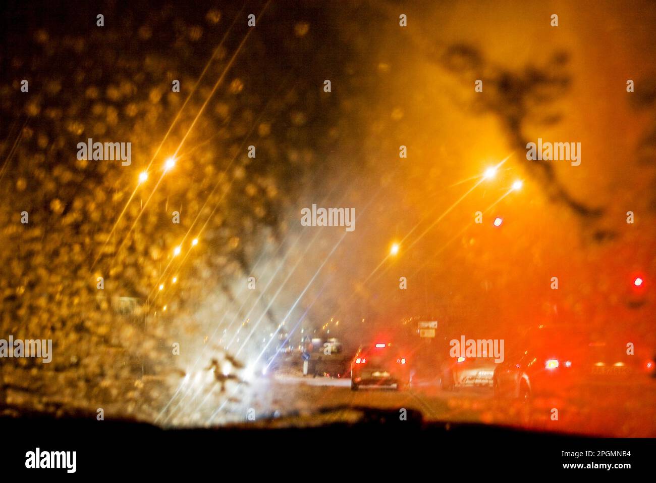 Driving a car in traffic jam in bad weather conditions Stock Photo - Alamy