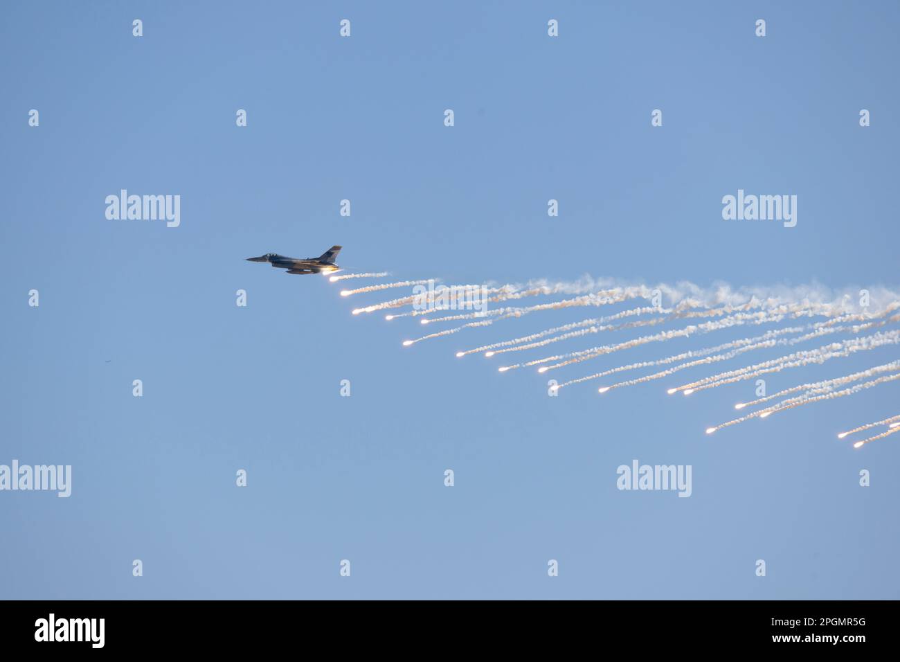 Las Vegas, NV - November 6, 2022: F-16 Fighter Jet Drops Flares During a Demo at the Aviation Nation airshow at Nellis AFB. Stock Photo