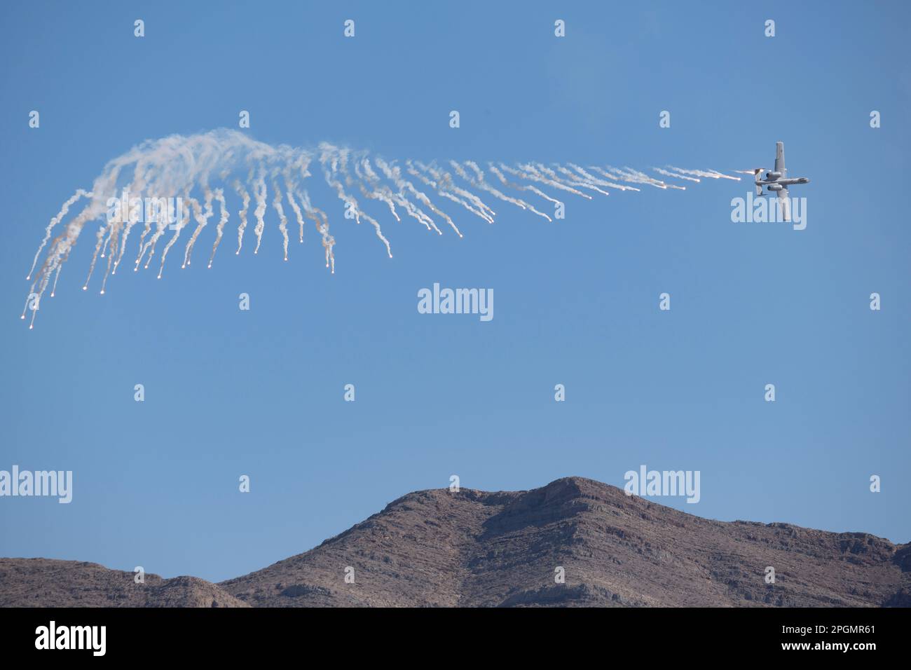 Las Vegas, NV - November 6, 2022: A-10 Warthog Attack Jet Drops Flares During a Demo at the Aviation Nation airshow at Nellis AFB. Stock Photo