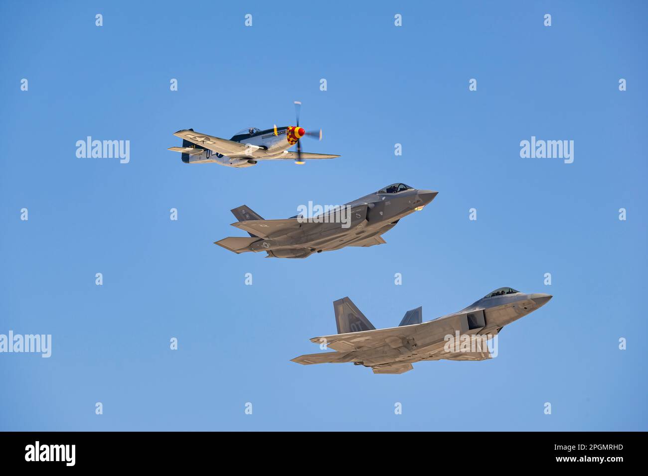 Las Vegas, NV - November 6, 2022: P-51 Mustang, USAF F-35 and USAF F-22 Do the Heritage Pass during the Aviation Nation airshow at Nellis AFB. Stock Photo