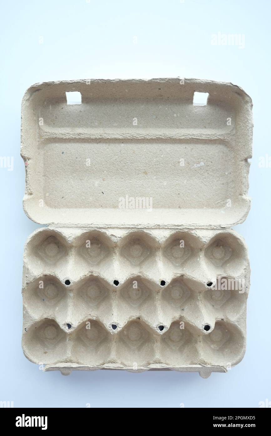 egg carton without eggs on table , Stock Photo