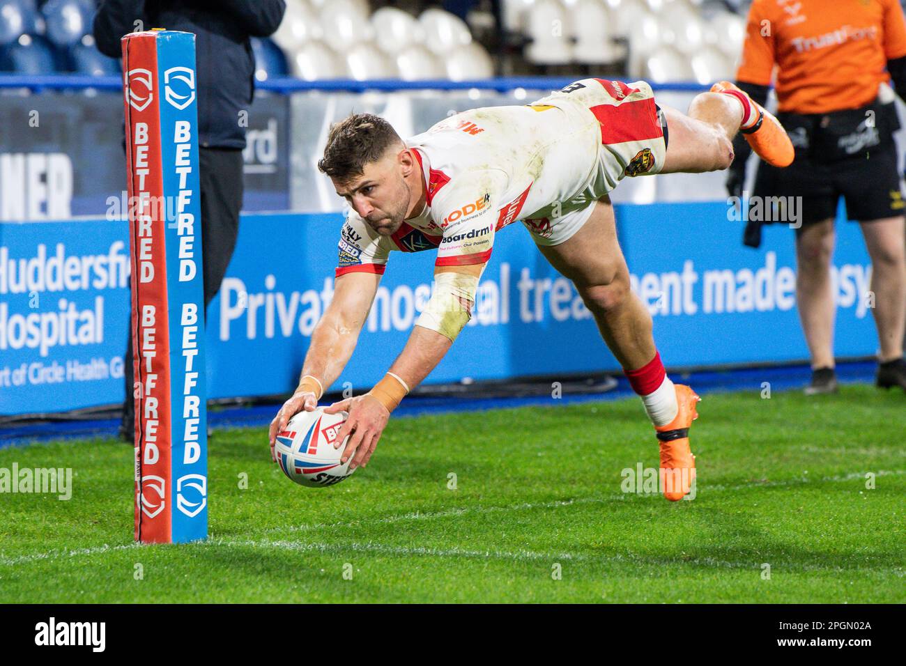 Tommy Makinson #2 of St Helens goes over for a try during the Betfred Super League Round 6 match Huddersfield Giants vs St Helens at John Smith's Stadium, Huddersfield, United Kingdom, 23rd March 2023  (Photo by Craig Thomas/News Images) Stock Photo
