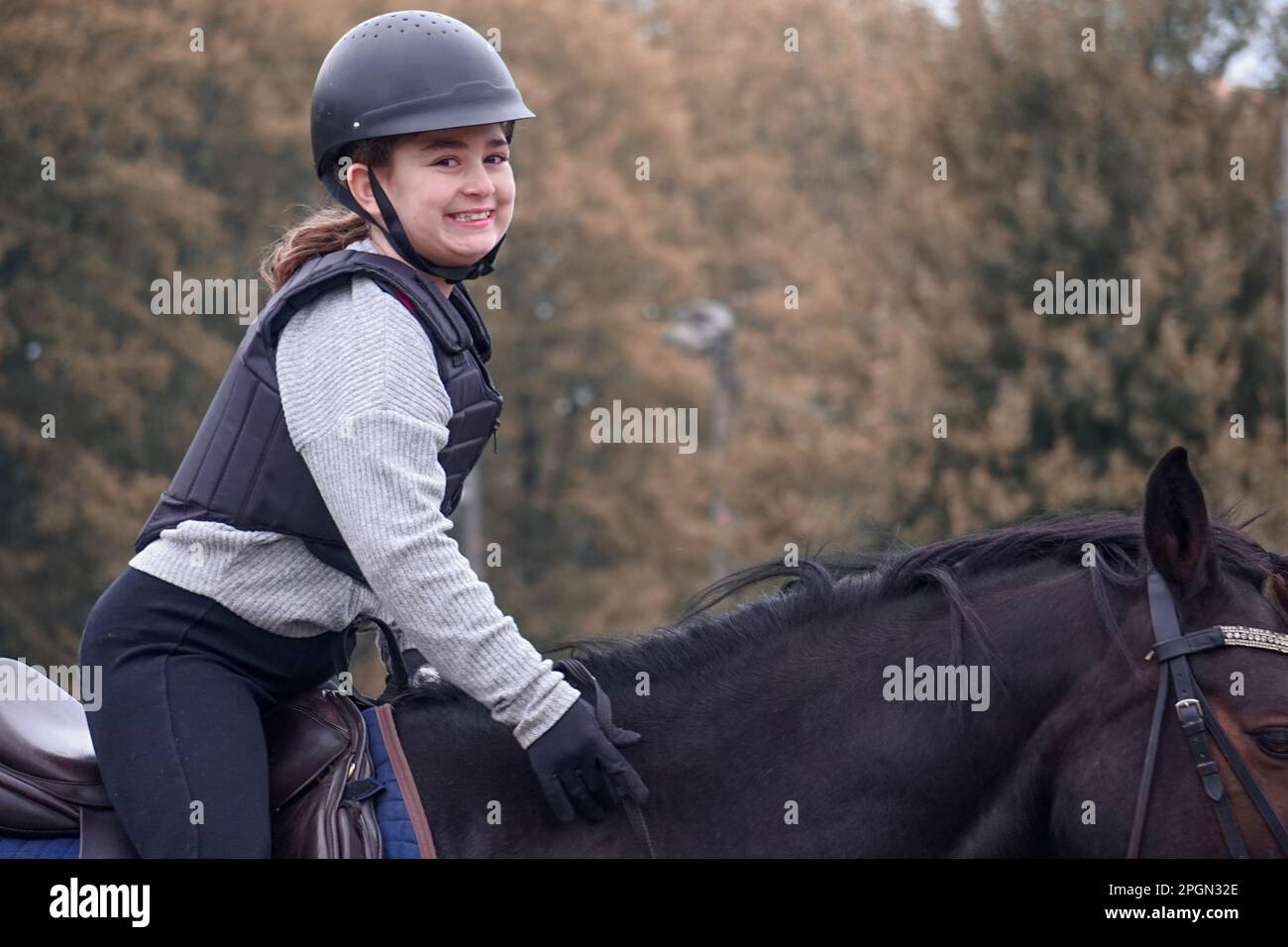 Portrait of a smiling children riding horse Stock Photo