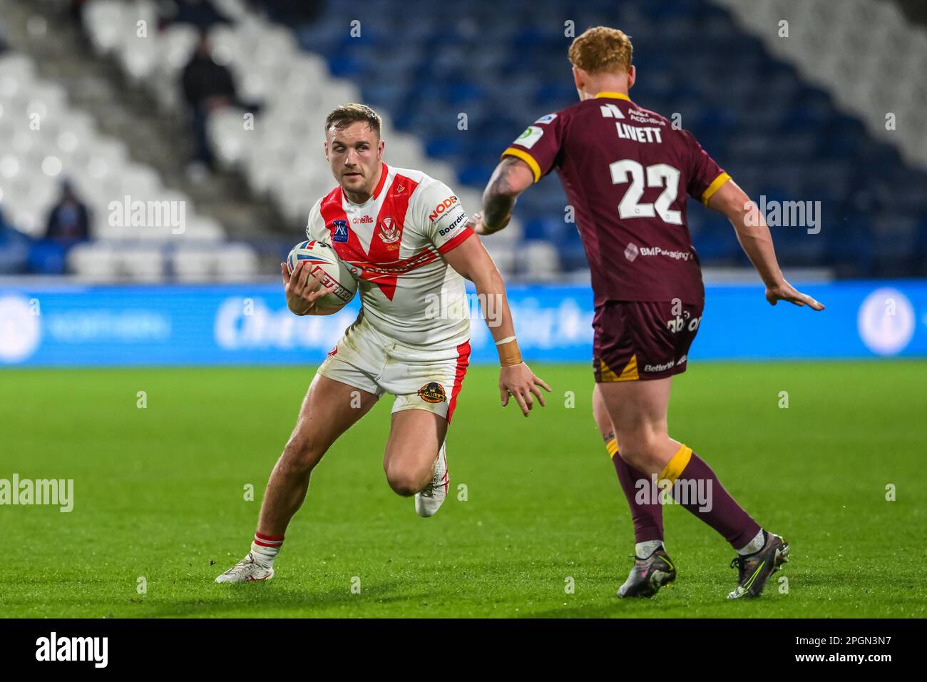 Matty Lees #10 of St Helens makes a break during the Betfred Super League Round 6 match Huddersfield Giants vs St Helens at John Smith's Stadium, Huddersfield, United Kingdom, 23rd March 2023  (Photo by Craig Thomas/News Images) Stock Photo